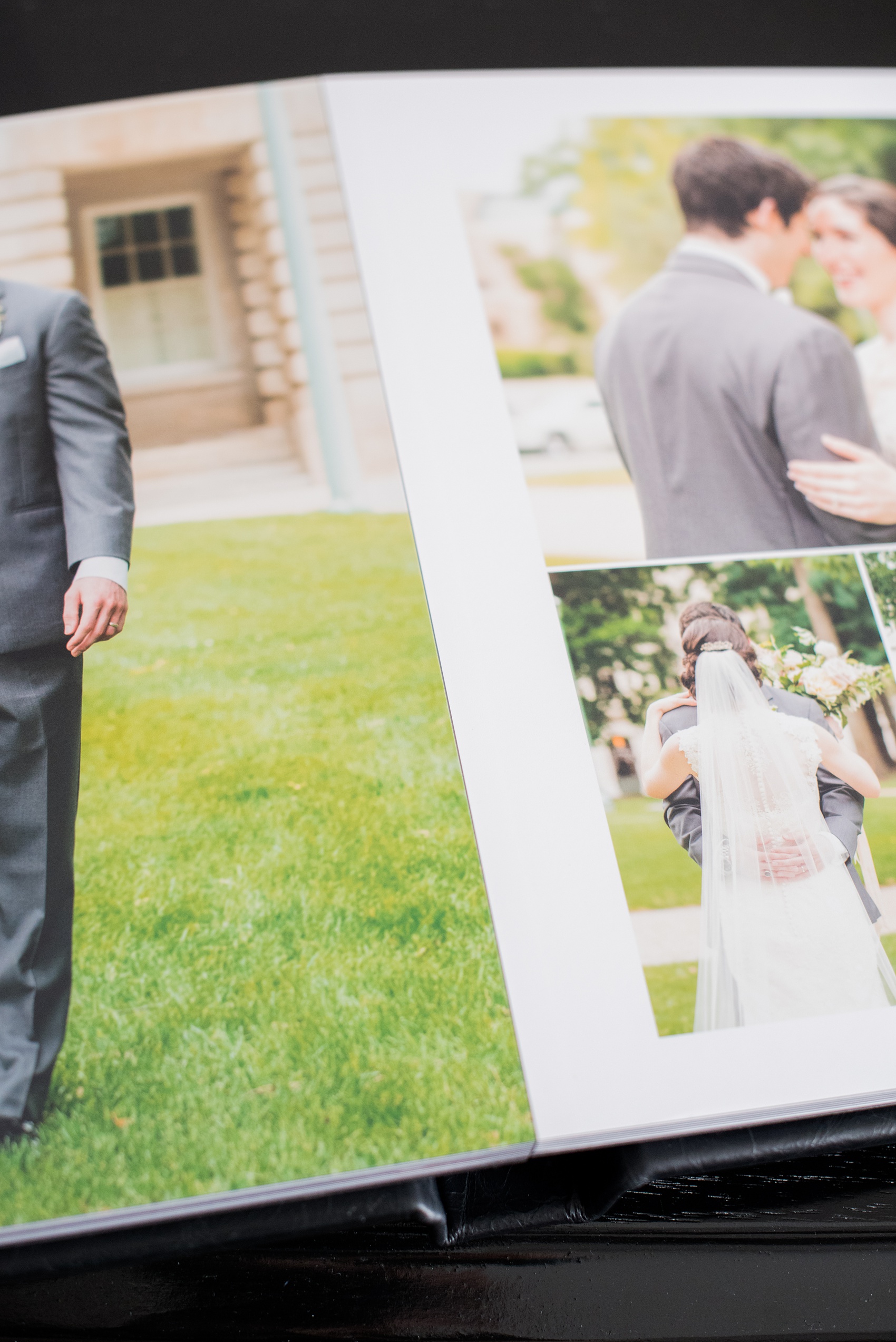 Images of a black calf leather fine art wedding album from Mikkel Paige Photography, a Raleigh, NC photographer. Photo shows the small distance in the gutter of the images.