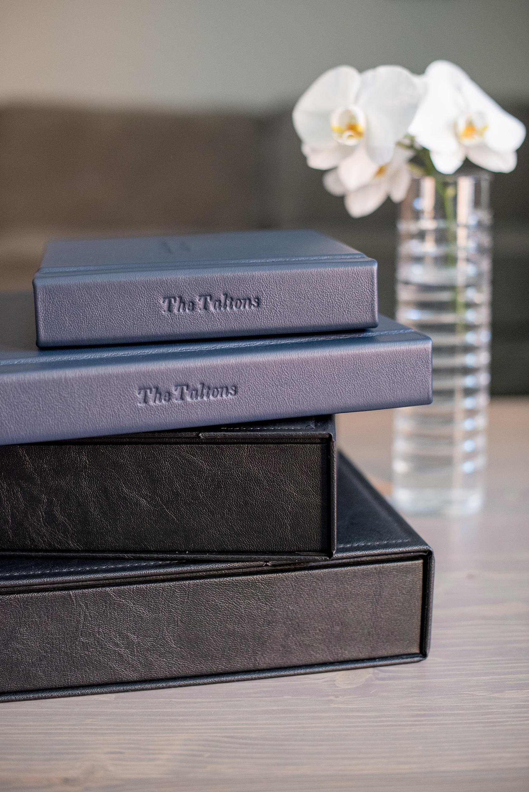 Images of a fine art leather wedding album in navy blue from Mikkel Paige Photography, a Raleigh, NC photographer.