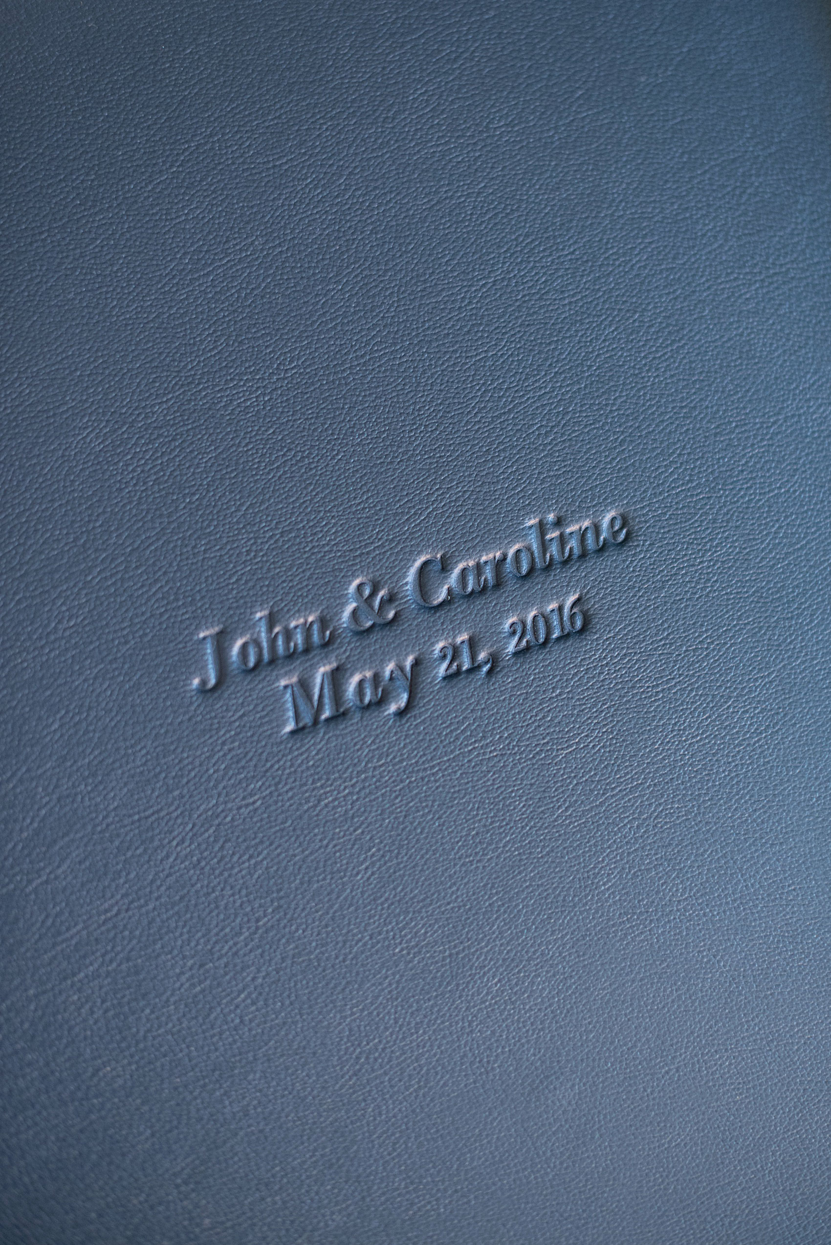 Images of a fine art leather wedding album in navy blue from Mikkel Paige Photography, a Raleigh, NC photographer.