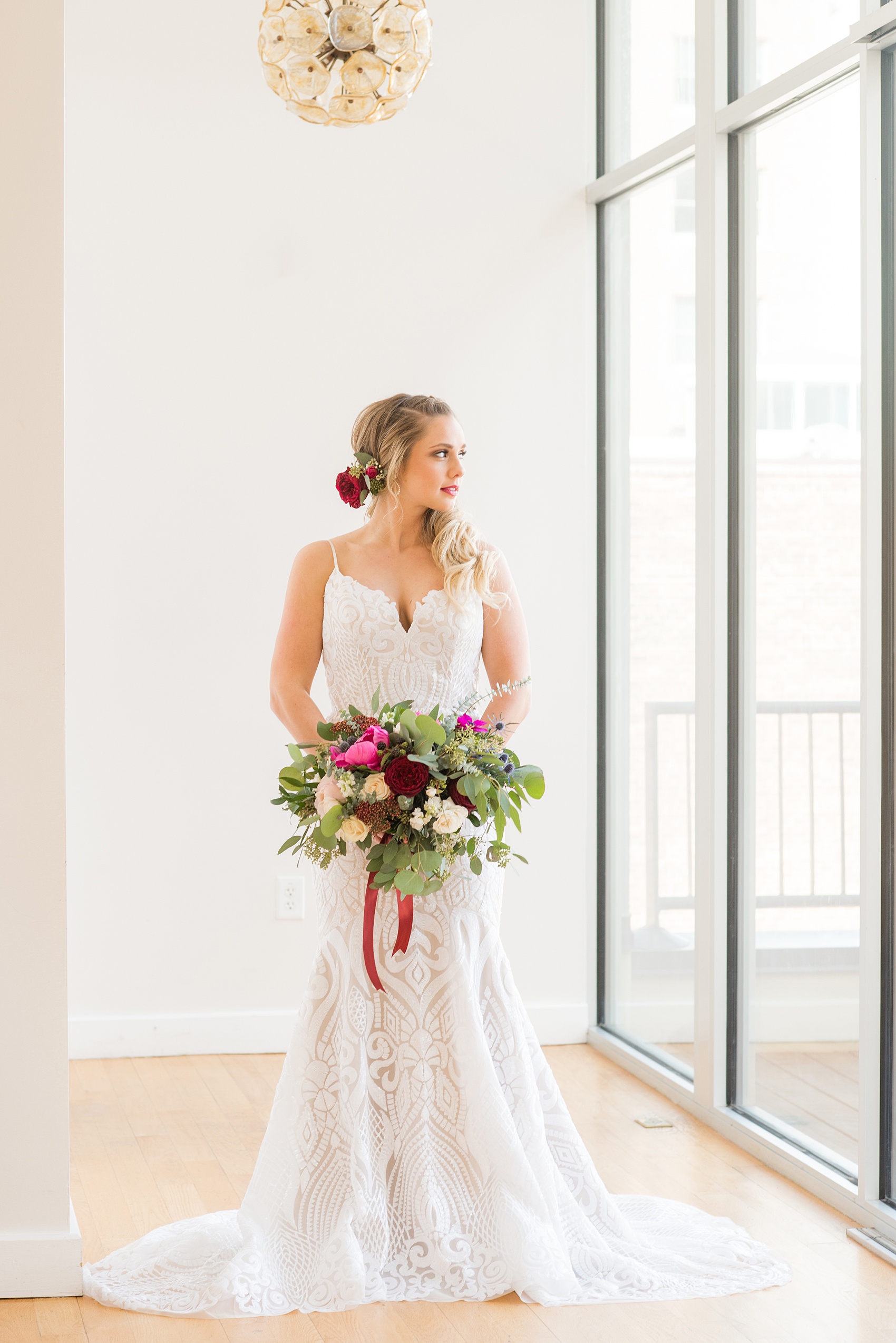 Photos from a wedding in downtown Raleigh, NC by Mikkel Paige Photography. The bride got ready at The Glass Box, pictured in her sequin Hayley Paige gown. Hair and makeup by Wink and dress and bouquet from Tre Bella.