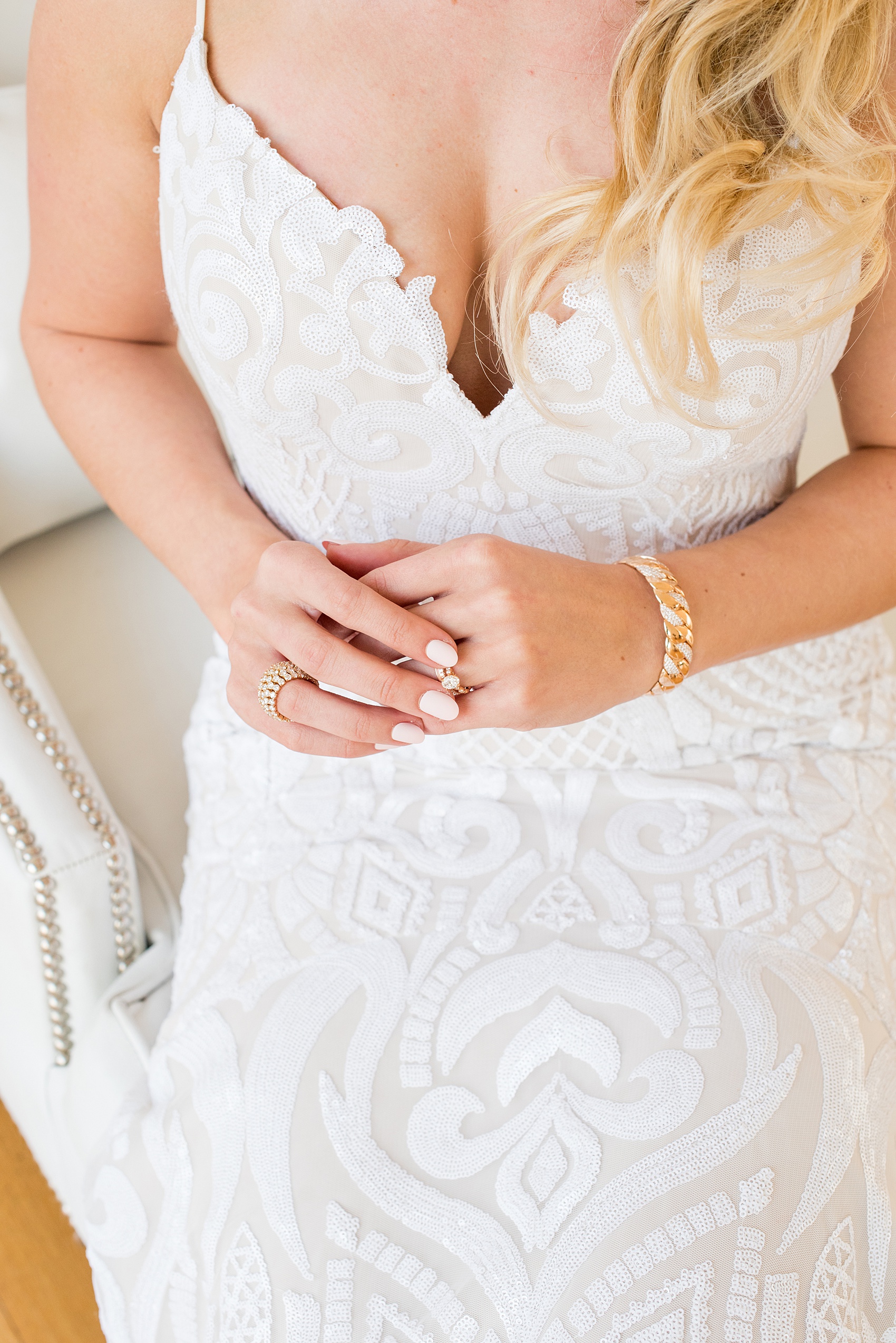 Photos from a wedding in downtown Raleigh, NC by Mikkel Paige Photography. The bride got ready at The Glass Box and wore a white sequin Hayley Paige gown from Tre Bella. Her rings are from Bailey's.