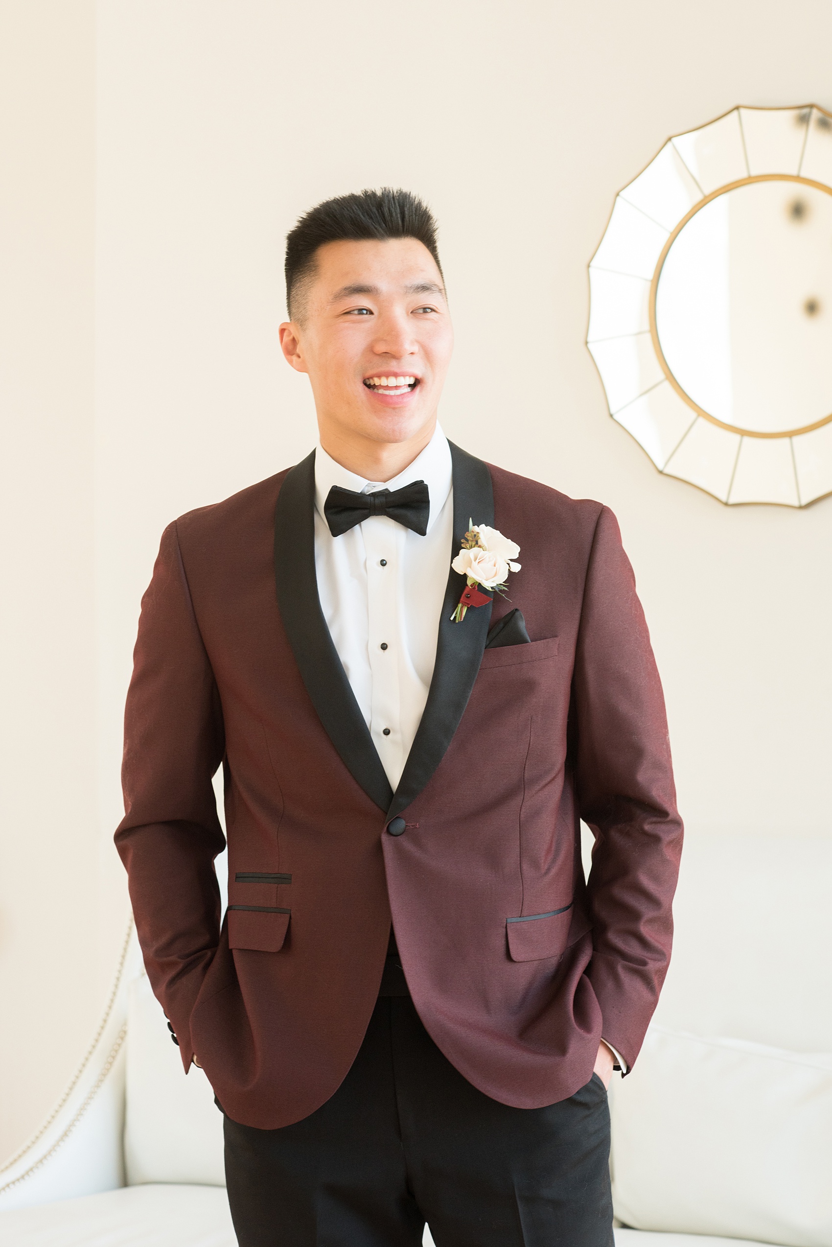 Photos from a wedding in downtown Raleigh, NC by Mikkel Paige Photography. The the groom wore a maroon tuxedo with black lapel from Bernard's Foralwear.