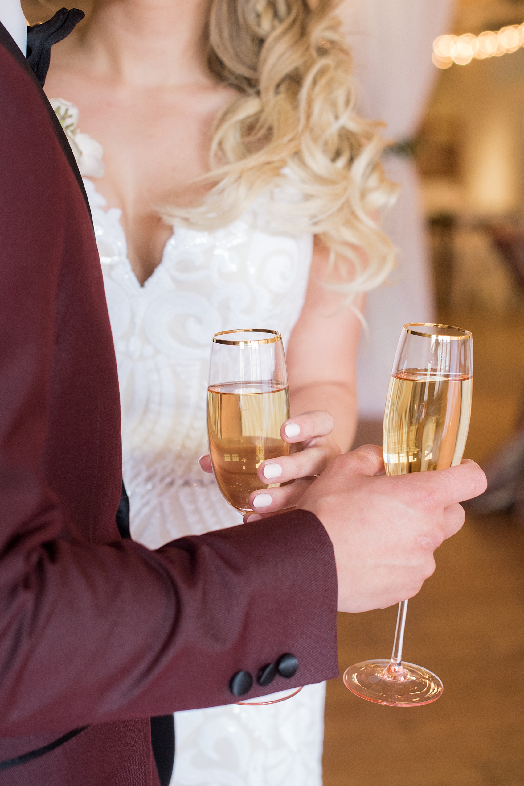 Photos from a wedding in downtown Raleigh, NC by Mikkel Paige Photography. The reception was held inside the historic venue, The Stockroom at 230. The bride and groom had pink champagne flutes for their February, Valentine's inspired wedding.