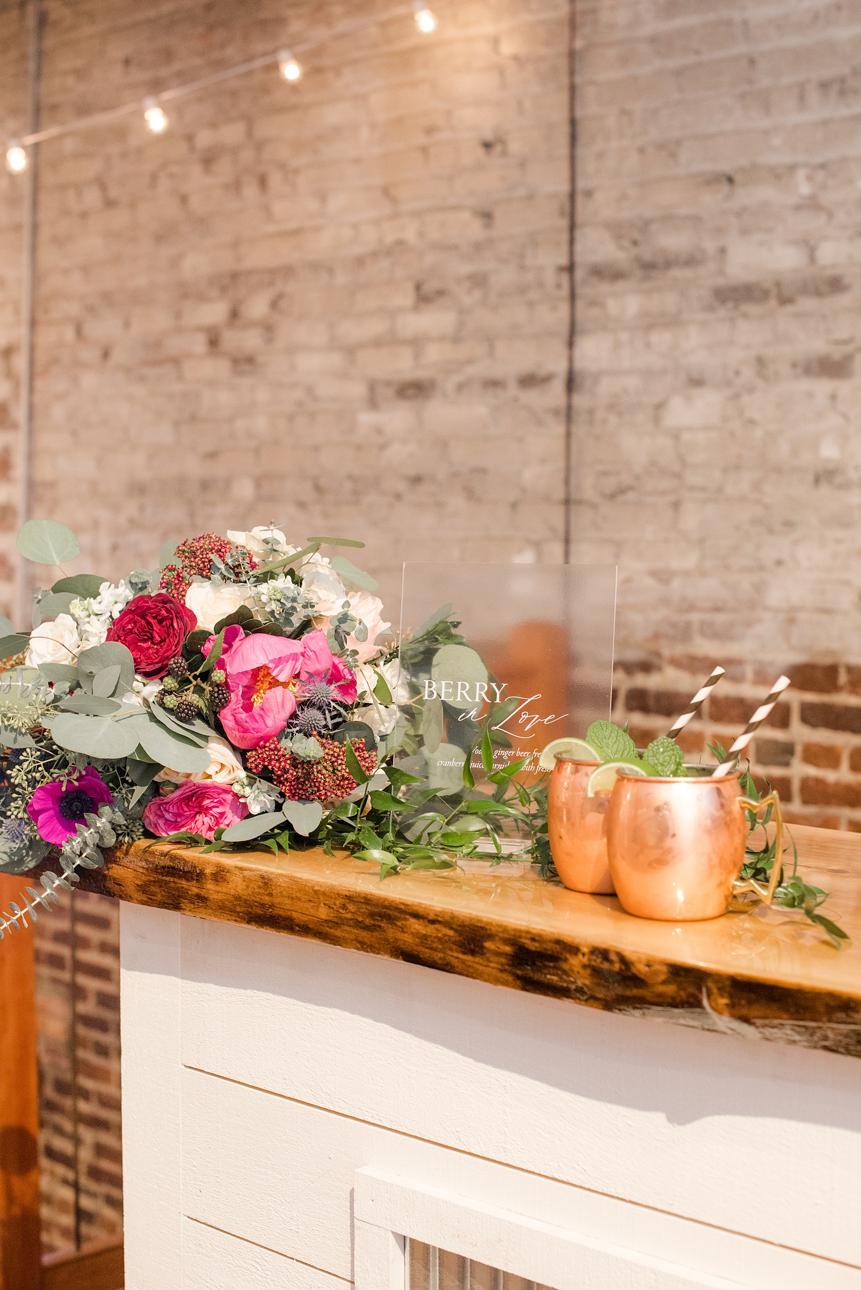 Photos from a wedding in downtown Raleigh, NC by Mikkel Paige Photography. The reception was held inside the historic venue, The Stockroom at 230. The signature cocktail by On the Rocks bartending was a Love on the Rocks.