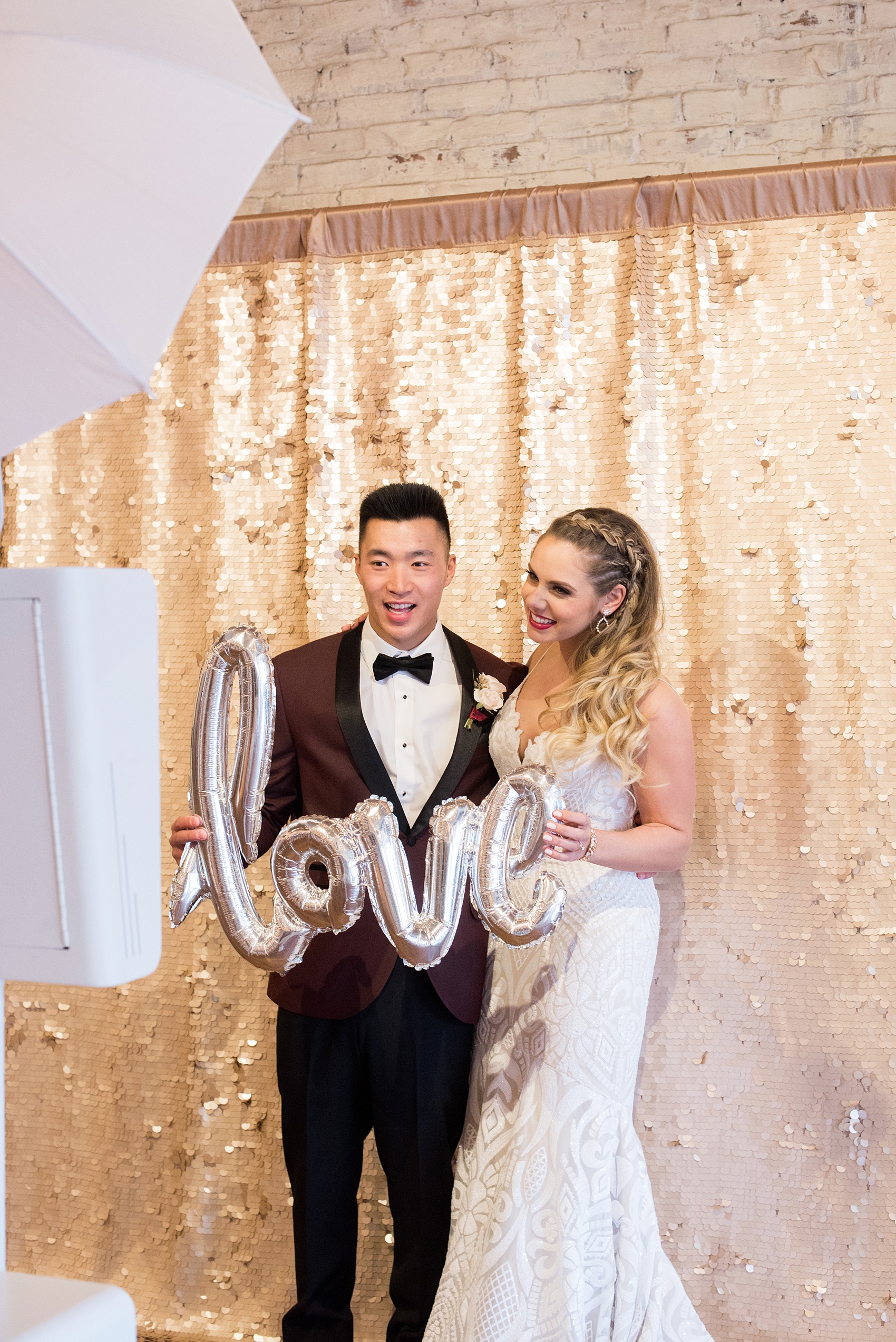 Photos from a wedding in downtown Raleigh, NC by Mikkel Paige Photography. The bride and groom enjoyed ZimZoom Photo Booth and a "love" mylar balloon prop at the reception at historic venue, The Stockroom at 230.