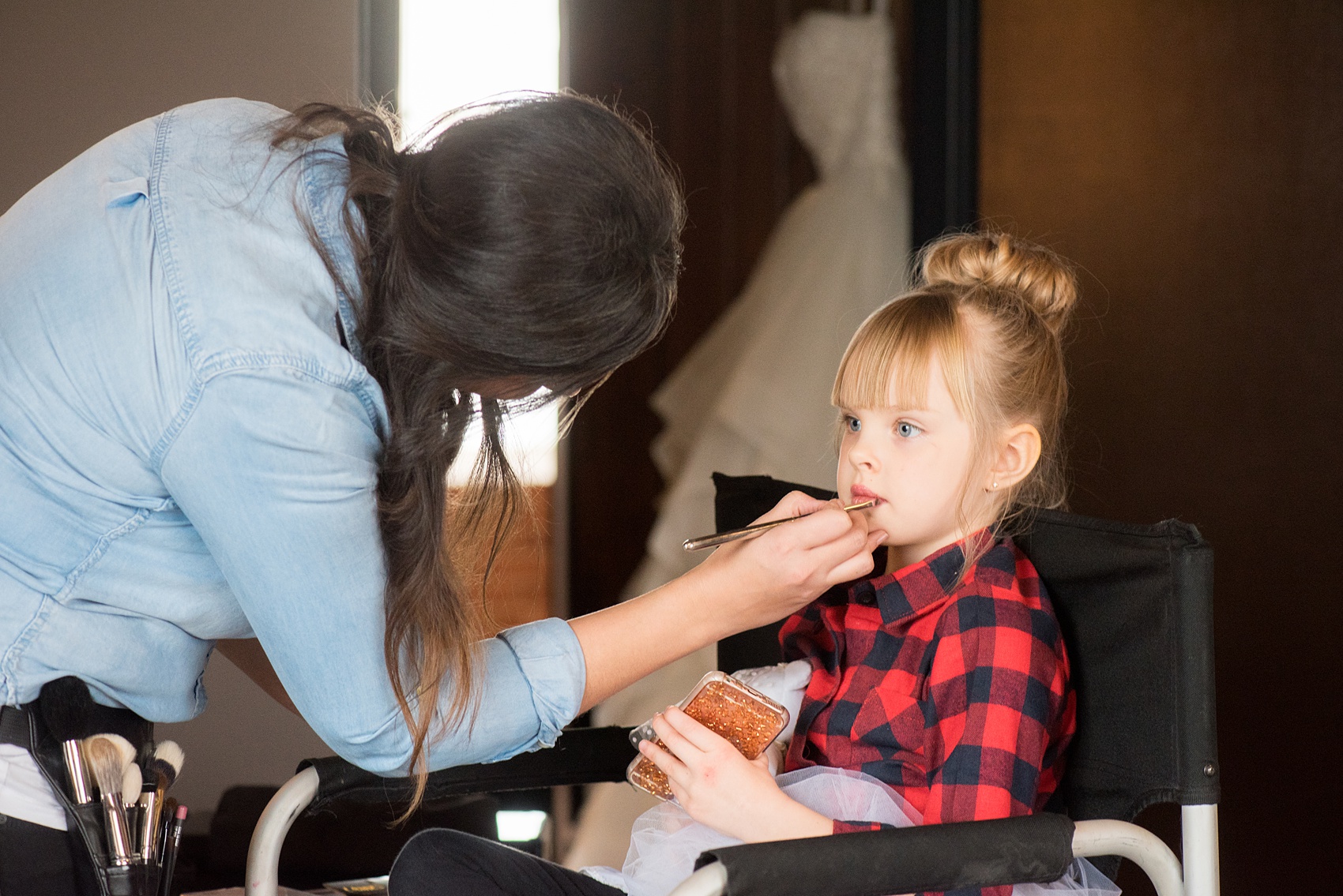 Durham wedding photos at The Cookery by Mikkel Paige Photography in North Carolina. The flower girl had her hair done in a high bun and makeup done! 