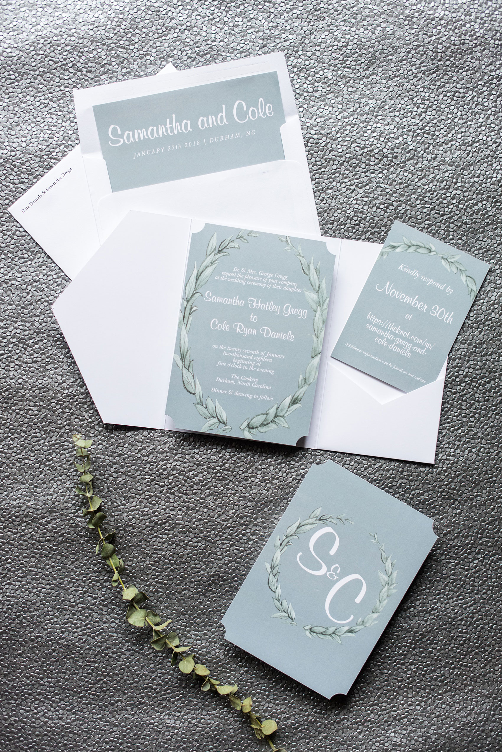 Durham wedding photos at The Cookery by Mikkel Paige Photography in North Carolina. The bride and groom had a winter wedding invitation to match their blue and green color palette. 