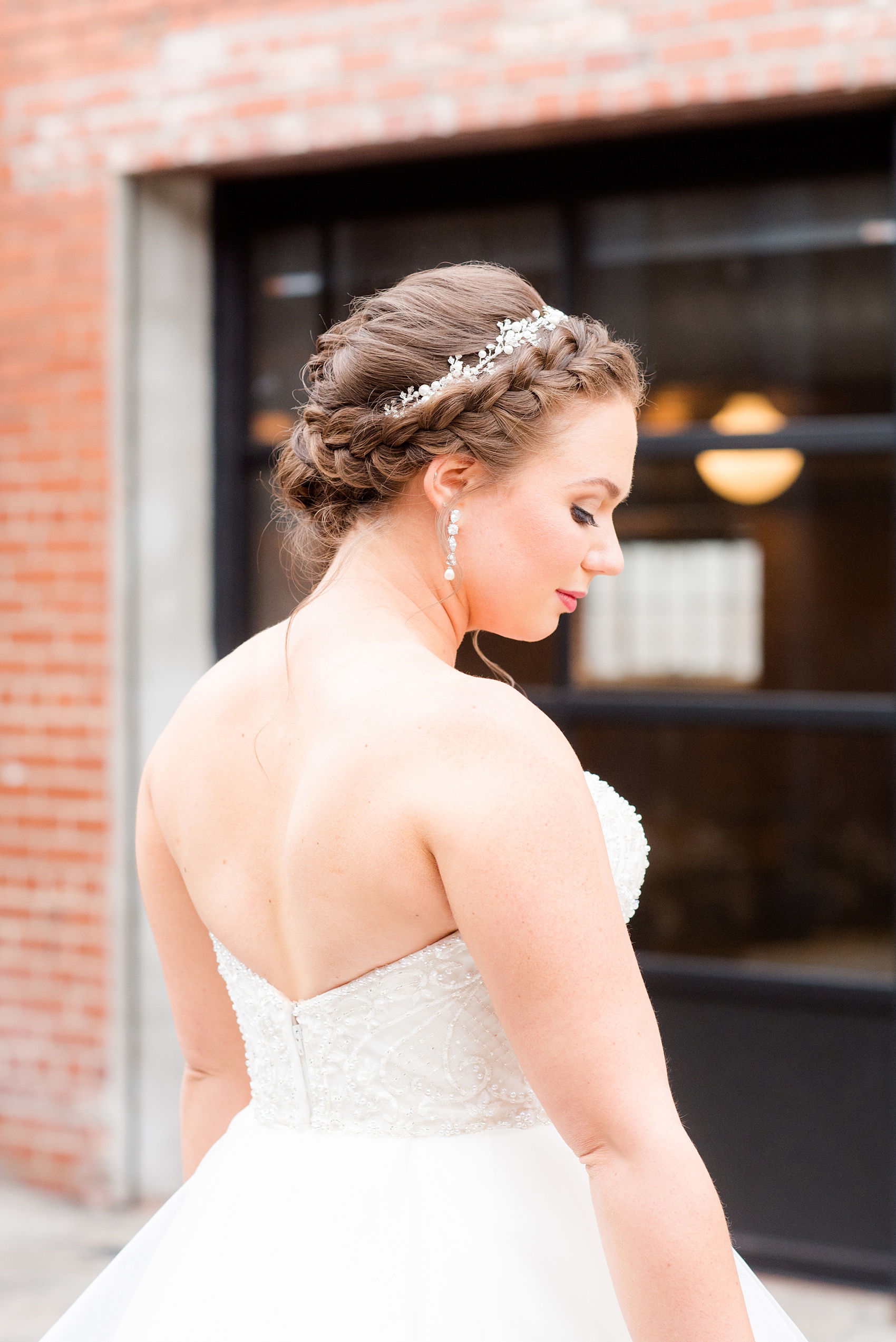 Durham wedding photos at The Cookery by Mikkel Paige Photography in North Carolina. The bride wore a strapless gown, had her hair in an up-do with a crown braid.