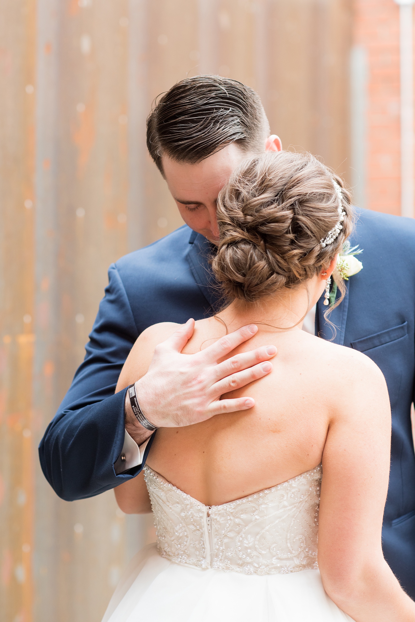 The groom softly kisses his bride in their Durham wedding photos at The Cookery by Mikkel Paige Photography in North Carolina. 