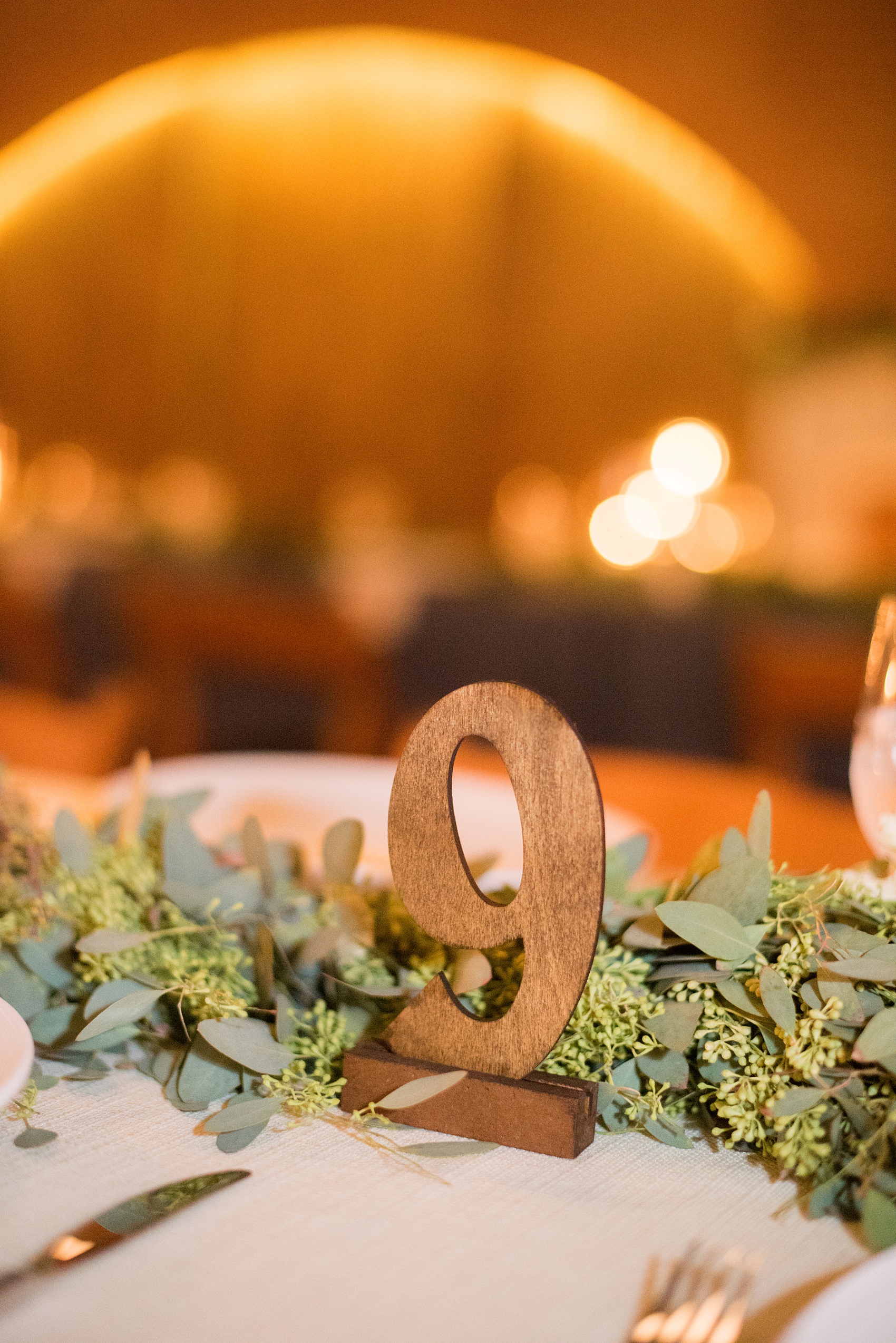 Indoor reception Durham wedding photos at The Cookery by Mikkel Paige Photography in North Carolina. Table numbers were indicated with wooden numbers.