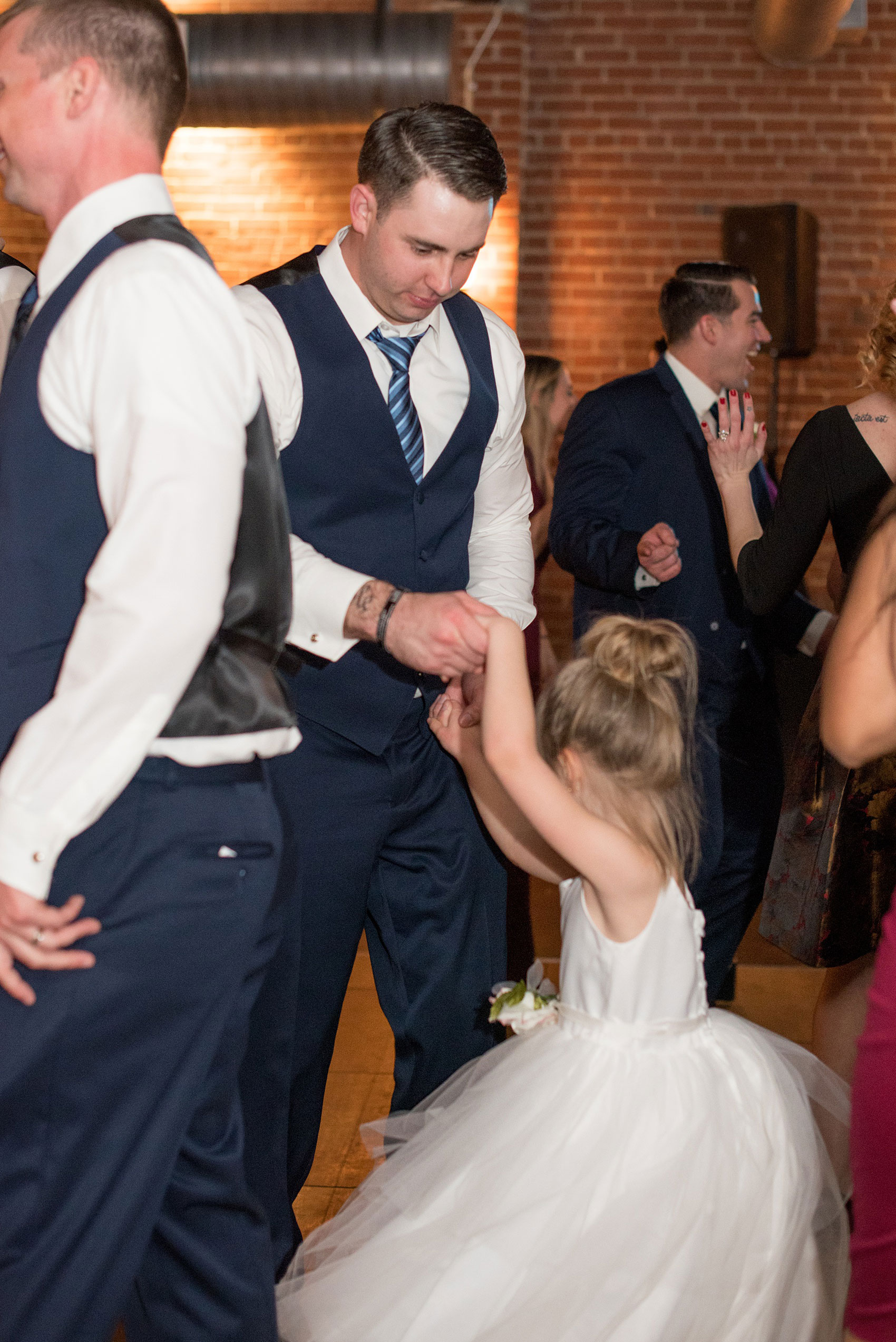 Durham wedding photos at The Cookery by Mikkel Paige Photography in North Carolina. The groom danced with his daughter, the flower girl, during the winter reception.