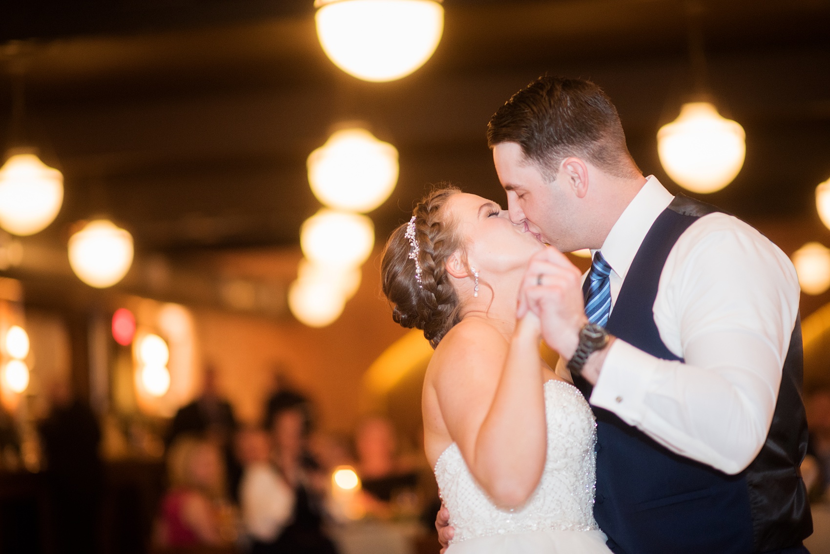 Durham wedding photos at The Cookery by Mikkel Paige Photography in North Carolina. The bride and groom kiss during their first dance.