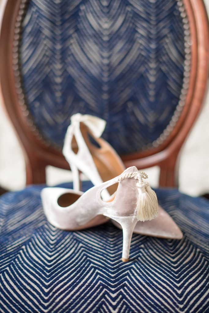 Wedding photos at Sleepy Hollow Country Club for a winter reception in January by Mikkel Paige Photography. The couple's Pittsburgh friends all contributed to a cookie table as dessert for the reception. Picture of the bride's Italian taupe velvet bridal heels by Aquazzura Firenze.