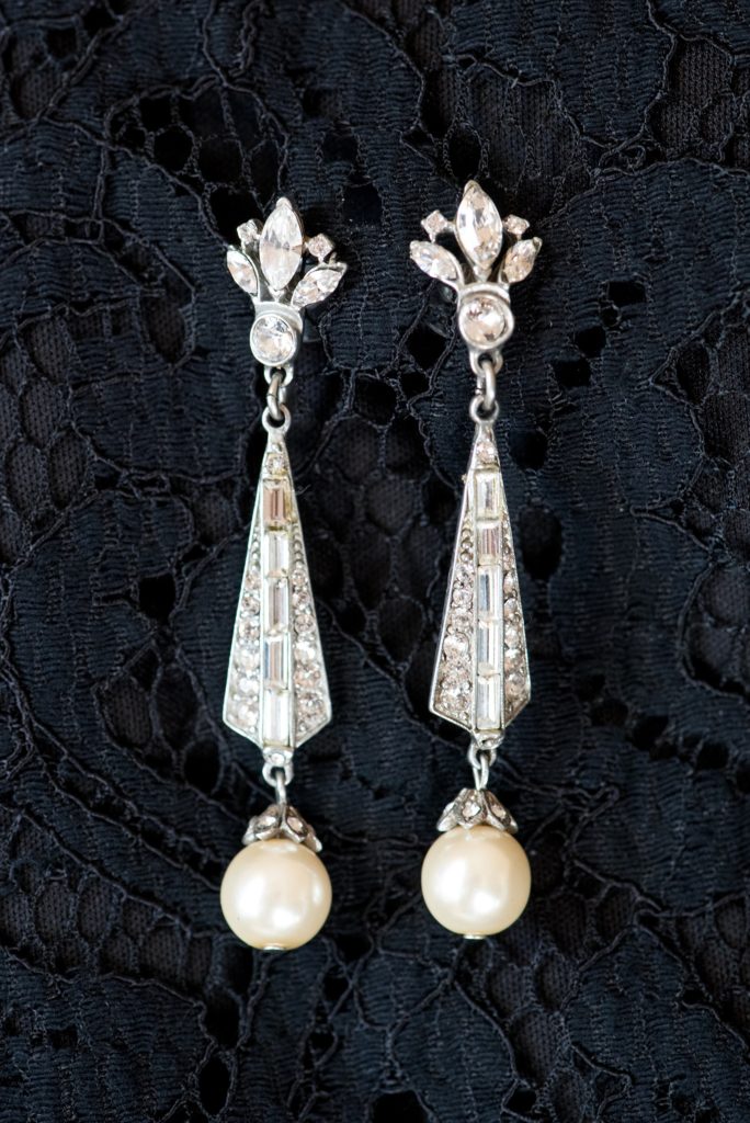 Wedding photos at Sleepy Hollow Country Club for a winter reception in January by Mikkel Paige Photography. A detail picture of the bride's vintage diamond and pearl earrings.