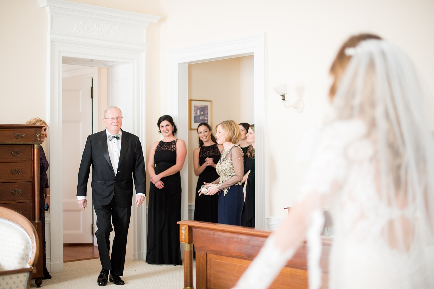 Wedding photos at Sleepy Hollow Country Club for a winter reception in January by Mikkel Paige Photography. A picture of the bride's father seeing her for the first time that day.