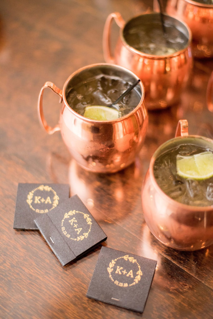 Wedding photos at Sleepy Hollow Country Club for a winter reception in January by Mikkel Paige Photography. The couple had custom matchbooks and moscow mules during their winter wedding in New York.