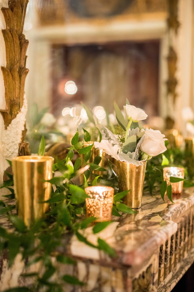 Wedding photos at Sleepy Hollow Country Club for a winter reception in January by Mikkel Paige Photography. Their New York winter wedding venue was decorated with lots of greenery and candlelight.