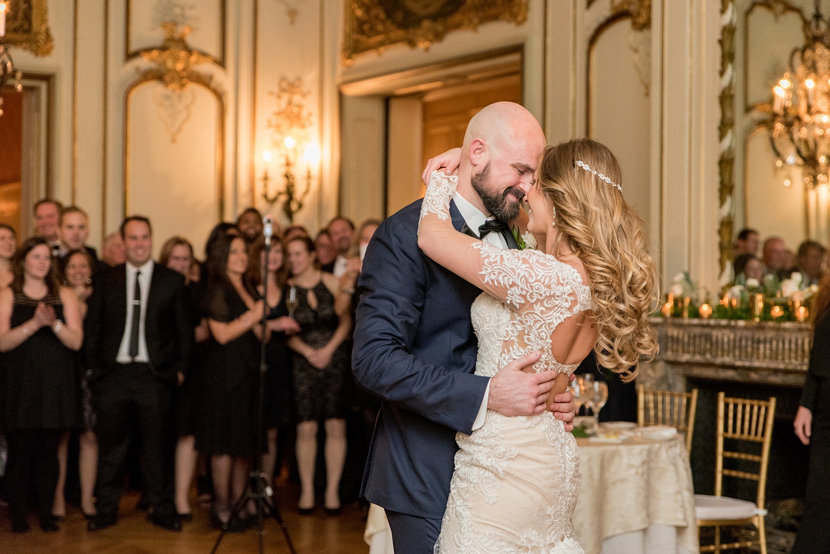 Wedding photos at Sleepy Hollow Country Club for a winter reception in January by Mikkel Paige Photography. They shared their first dance at their NY winter wedding, inside the ornate center room of the venue.