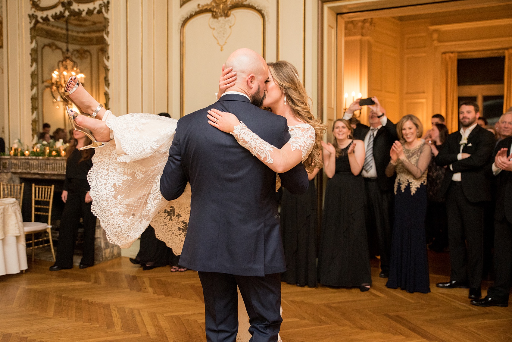 Wedding photos at Sleepy Hollow Country Club for a winter reception in January by Mikkel Paige Photography. They shared their first dance at their NY winter wedding, inside the ornate center room of the venue.