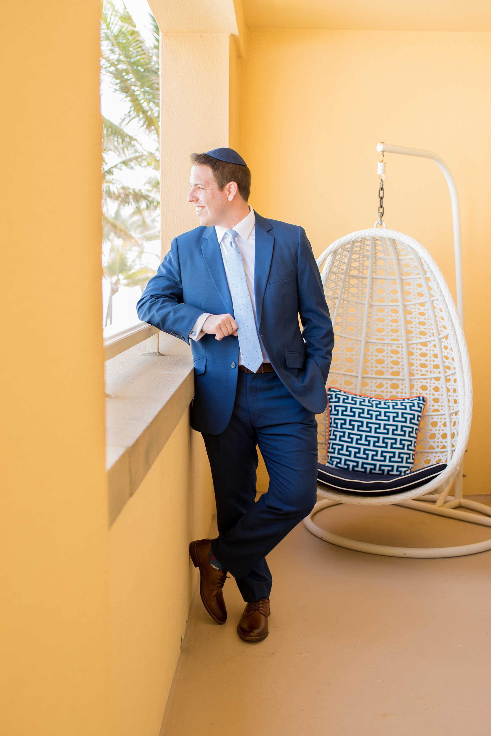 Eau Palm Beach wedding photos by Mikkel Paige Photography. This luxury Florida resort is a beautiful destination location for a wedding! In this picture, the groom reflects on the day before seeing his bride. Click through for more! #WestPalmBeach #EauPalmBeach #BeachWedding #FloridaWeddings