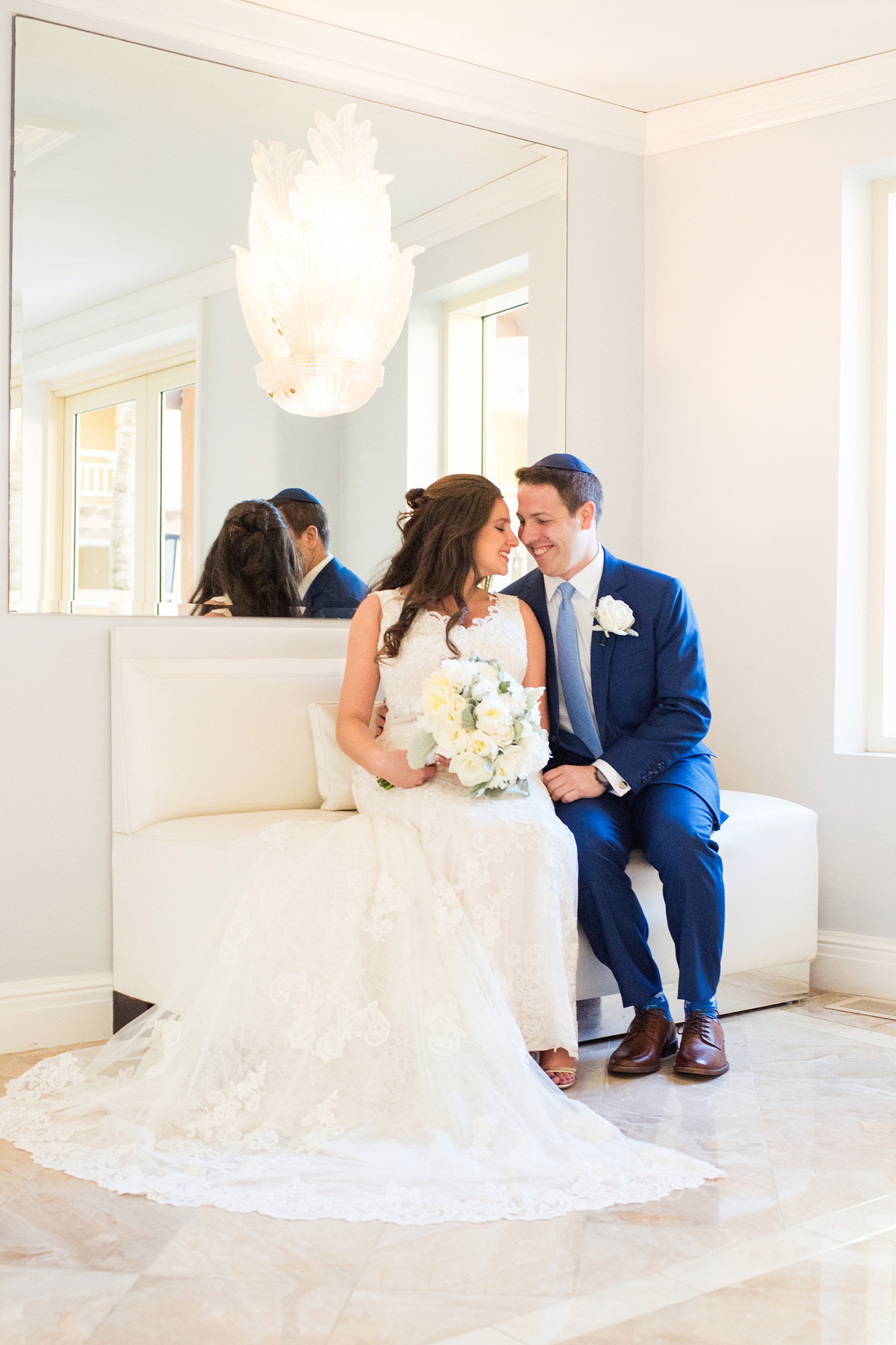 Eau Palm Beach wedding photos by Mikkel Paige Photography. This luxury Florida hotel is a beautiful location for a destination wedding. The bride and groom took pictures around the resort before their ceremony. Click through to see more! #WestPalmBeach #EauPalmBeach #BeachWedding #FloridaWeddings #BeachBride