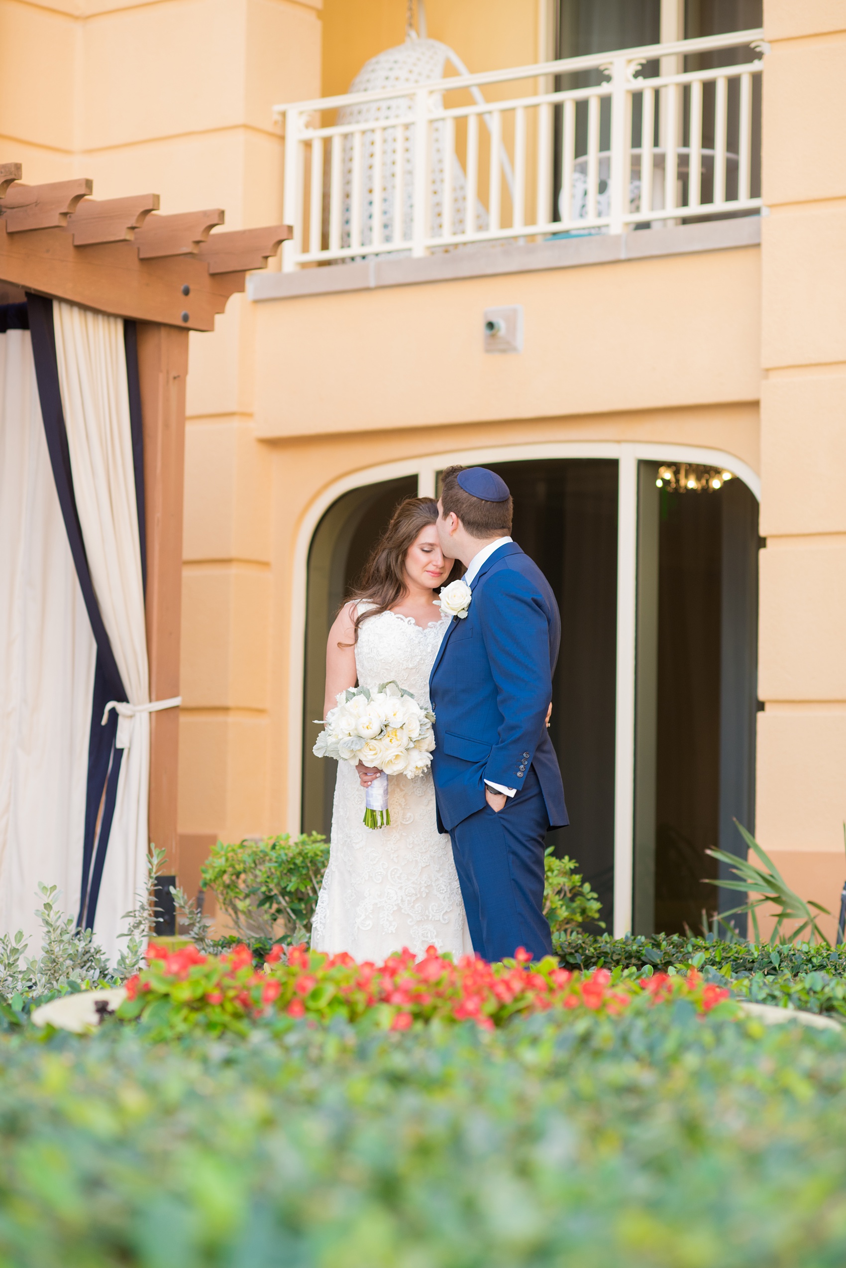 Eau Palm Beach wedding photos by Mikkel Paige Photography. This luxury Florida hotel is a beautiful location for a destination wedding. The bride and groom took pictures around the resort before their ceremony. Click through to see more! #WestPalmBeach #EauPalmBeach #BeachWedding #FloridaWeddings #BeachBride