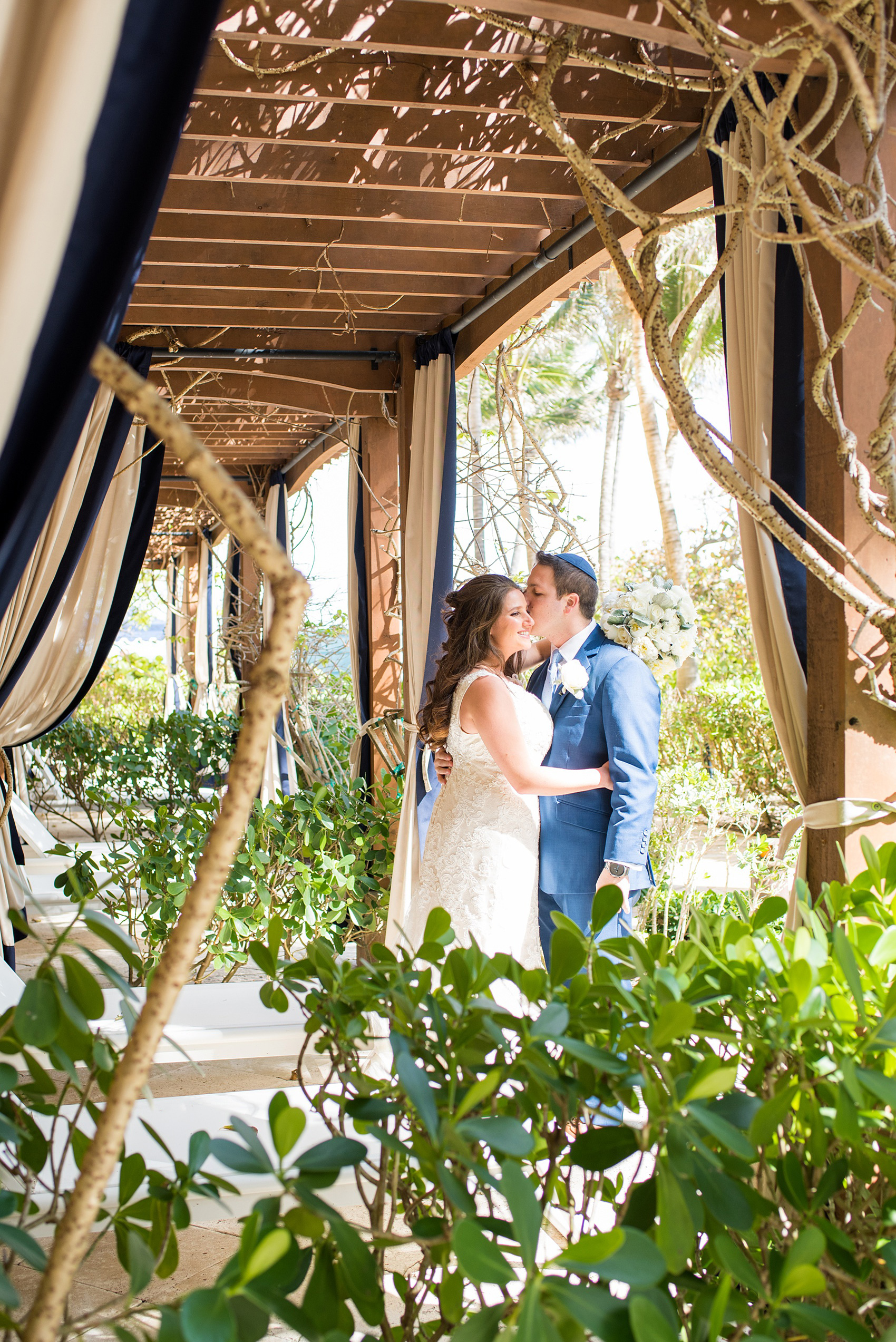 Eau Palm Beach wedding photos by Mikkel Paige Photography. This luxury Florida hotel is a beautiful location for a destination wedding. The bride and groom took pictures around the resort before their ceremony. Click through to see more! #WestPalmBeach #EauPalmBeach #BeachWedding #FloridaWeddings #BeachBride