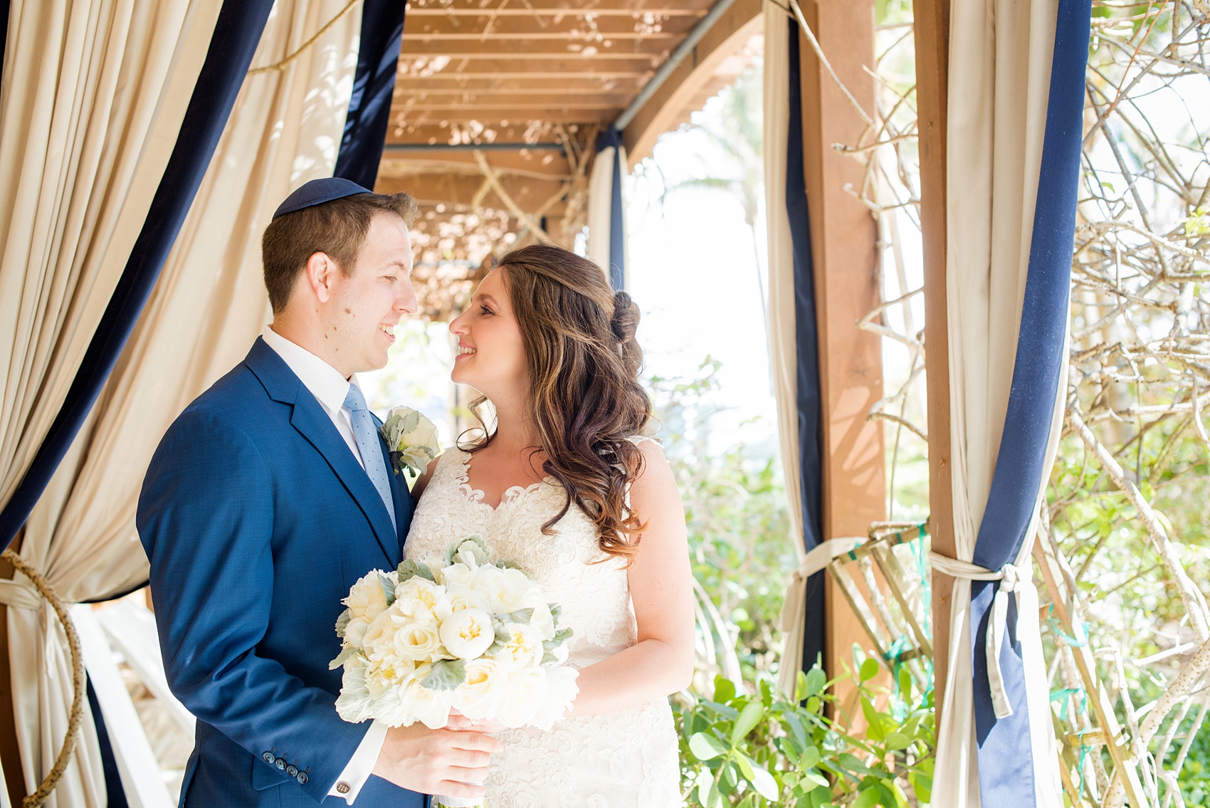 Eau Palm Beach wedding photos by Mikkel Paige Photography. This luxury Florida hotel is a beautiful location for a destination wedding. The bride and groom took pictures around the resort before their ceremony. Click through to see more! #WestPalmBeach #EauPalmBeach #BeachWedding #FloridaWeddings #BeachBride