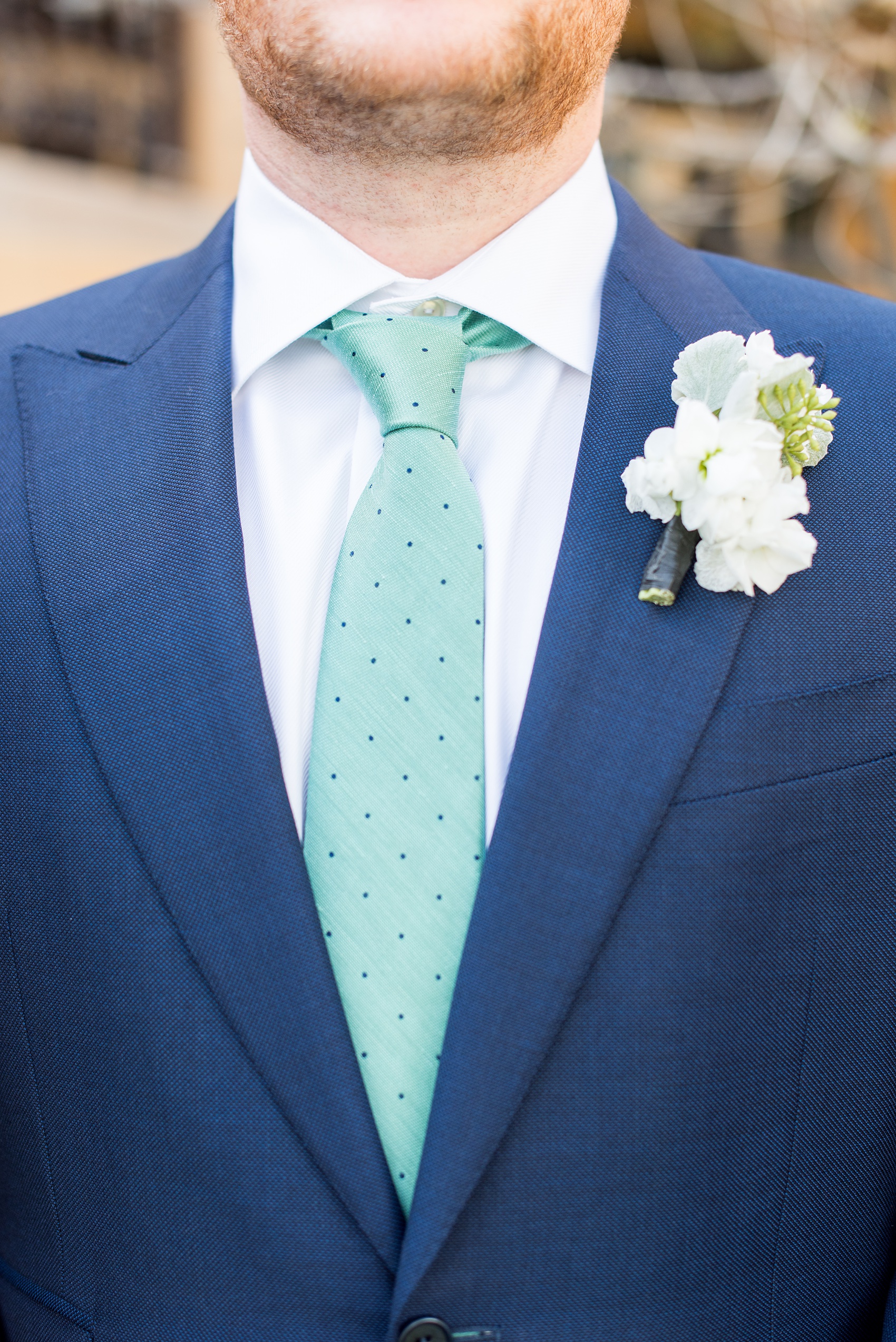 Eau Palm Beach wedding photos by Mikkel Paige Photography. This luxury Florida hotel is a beautiful location for a destination wedding. The groomsmen wore navy suits with a white boutonniere and aqua blue dot ties. Click through to see more! #WestPalmBeach #EauPalmBeach #BeachWedding #FloridaWeddings #groomsmen