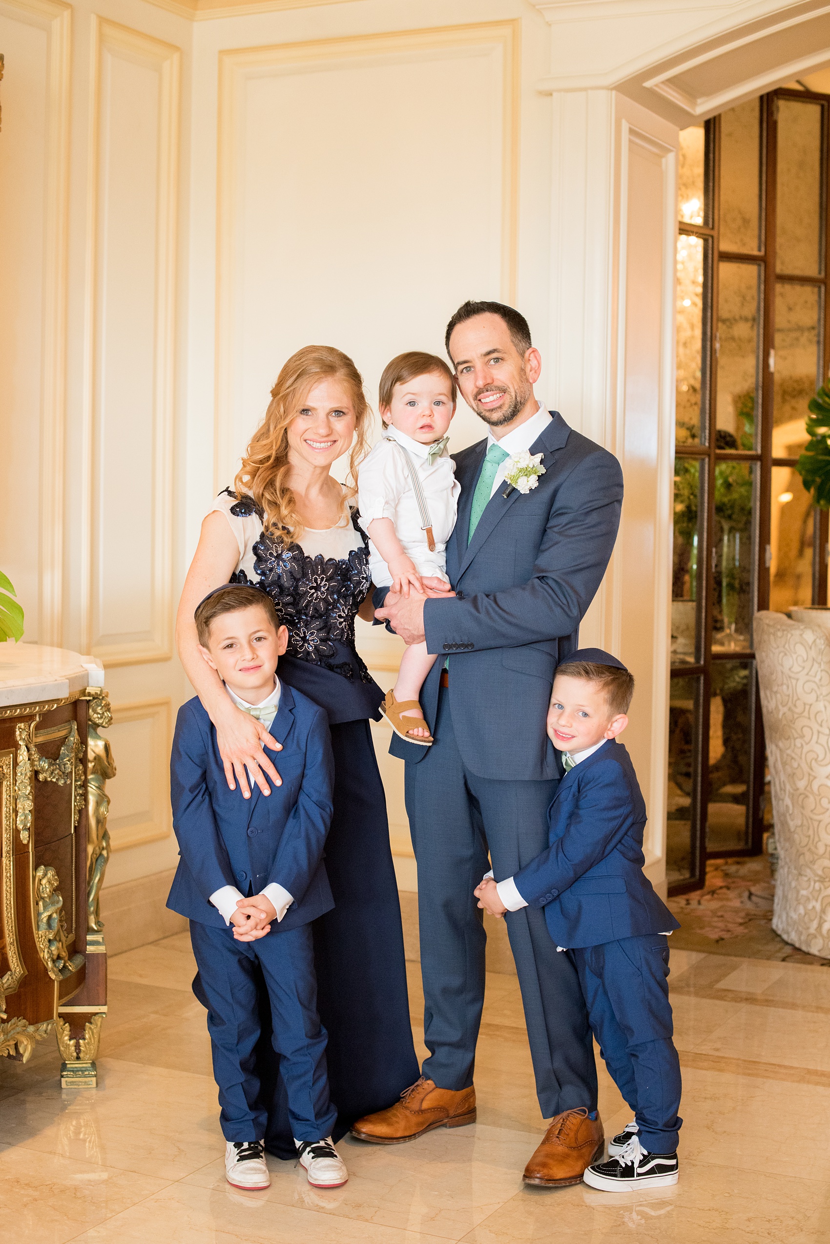 Eau Palm Beach wedding photos by destination photographer, Mikkel Paige. This luxury Florida hotel is a beautiful location for a destination wedding. The groom's sister and her family were in the wedding party, wearing navy blue to compliment the wedding party. Click through to see more! #WestPalmBeach #EauPalmBeach #BeachWedding #FloridaWeddings #BeachBride