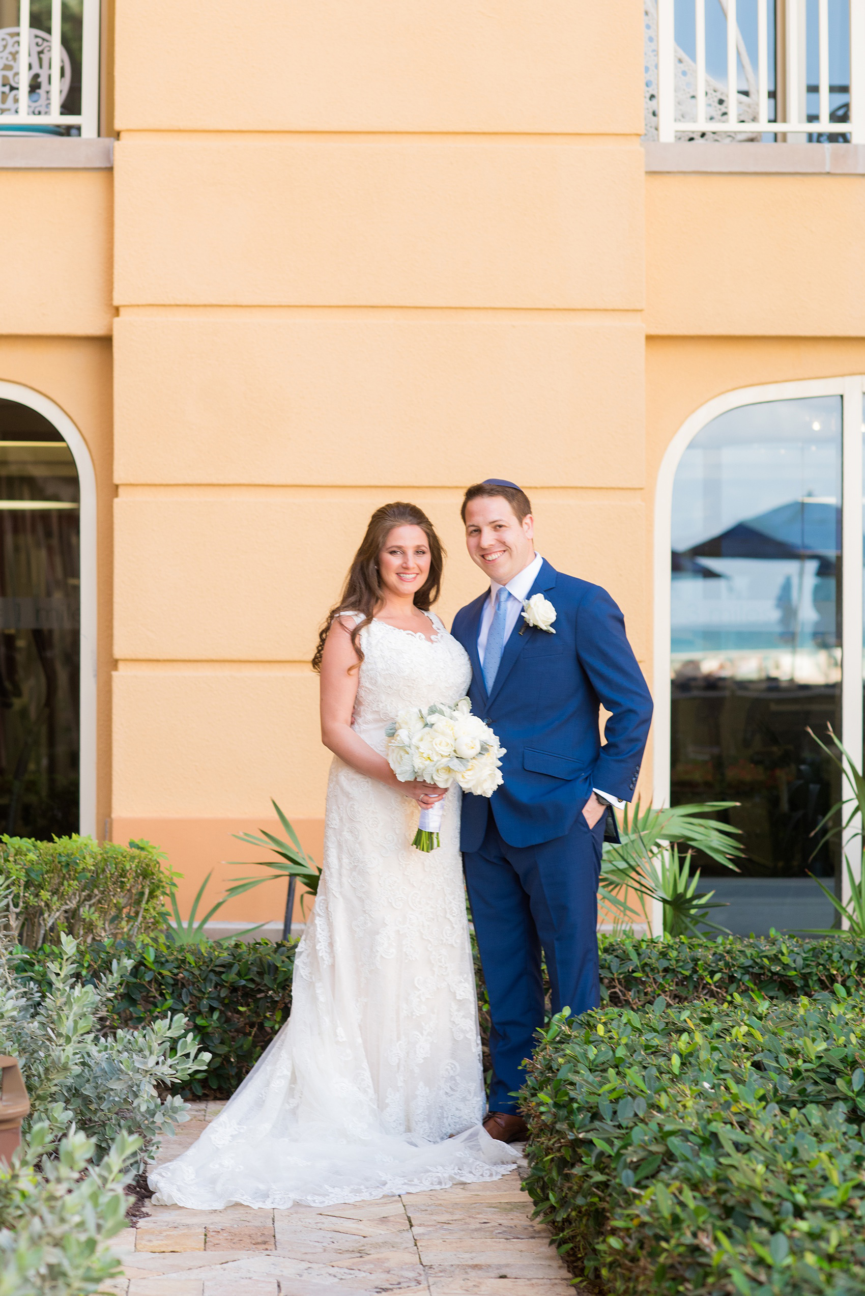 Eau Palm Beach wedding photos by Mikkel Paige Photography. This luxury Florida hotel is a beautiful location for a destination wedding. The bride and groom took pictures around the resort before their ceremony. Click through to see more! #WestPalmBeach #EauPalmBeach #BeachWedding #FloridaWeddings #BeachBride 