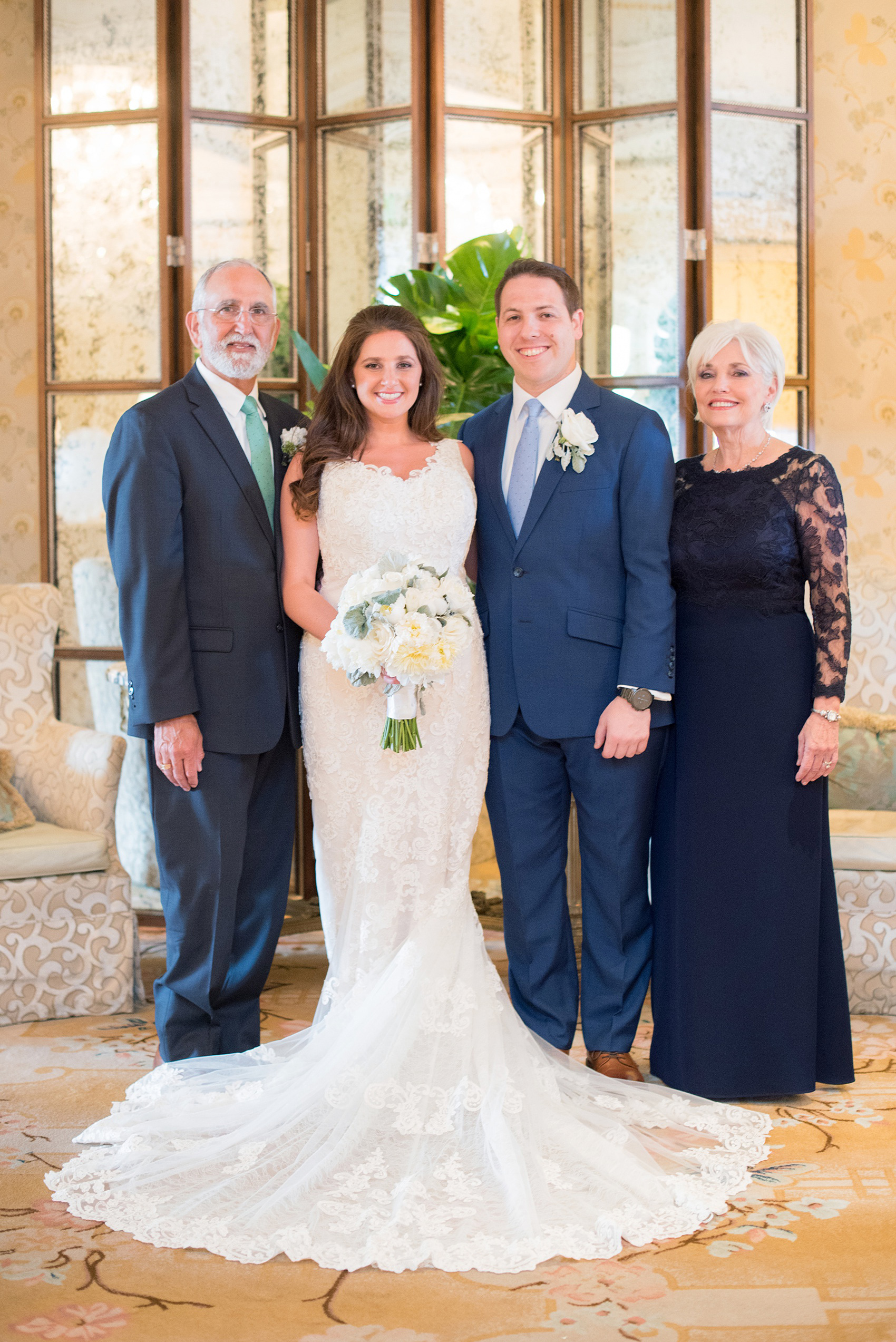Eau Palm Beach wedding photos by Mikkel Paige Photography. This luxury Florida resort is a beautiful destination location for a wedding! The ornate lobby was the perfect location for family photos. Click through for more details from this waterfront wedding! #WestPalmBeach #EauPalmBeach #BeachWedding #turtles
