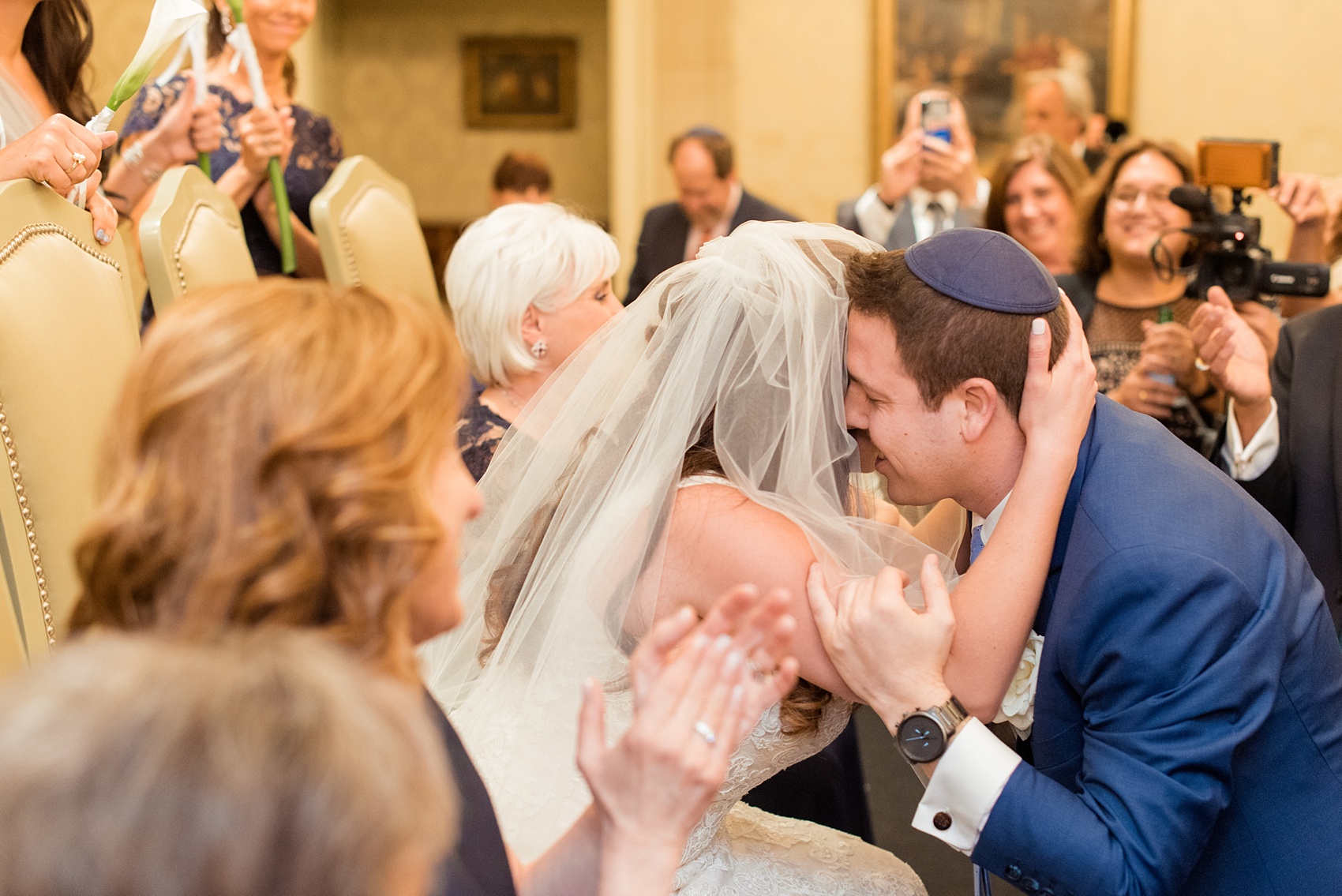 Eau Palm Beach wedding photos by destination photographer, Mikkel Paige. This luxury West Palm Beach, Florida hotel is a beautiful location for a destination wedding. The traditional Jewish ceremony had a bedekan and tish, where the groom lowered the bride's veil blusher on her face. Click through to see more! #WestPalmBeach #EauPalmBeach #BeachWedding #FloridaWeddings #BeachBride