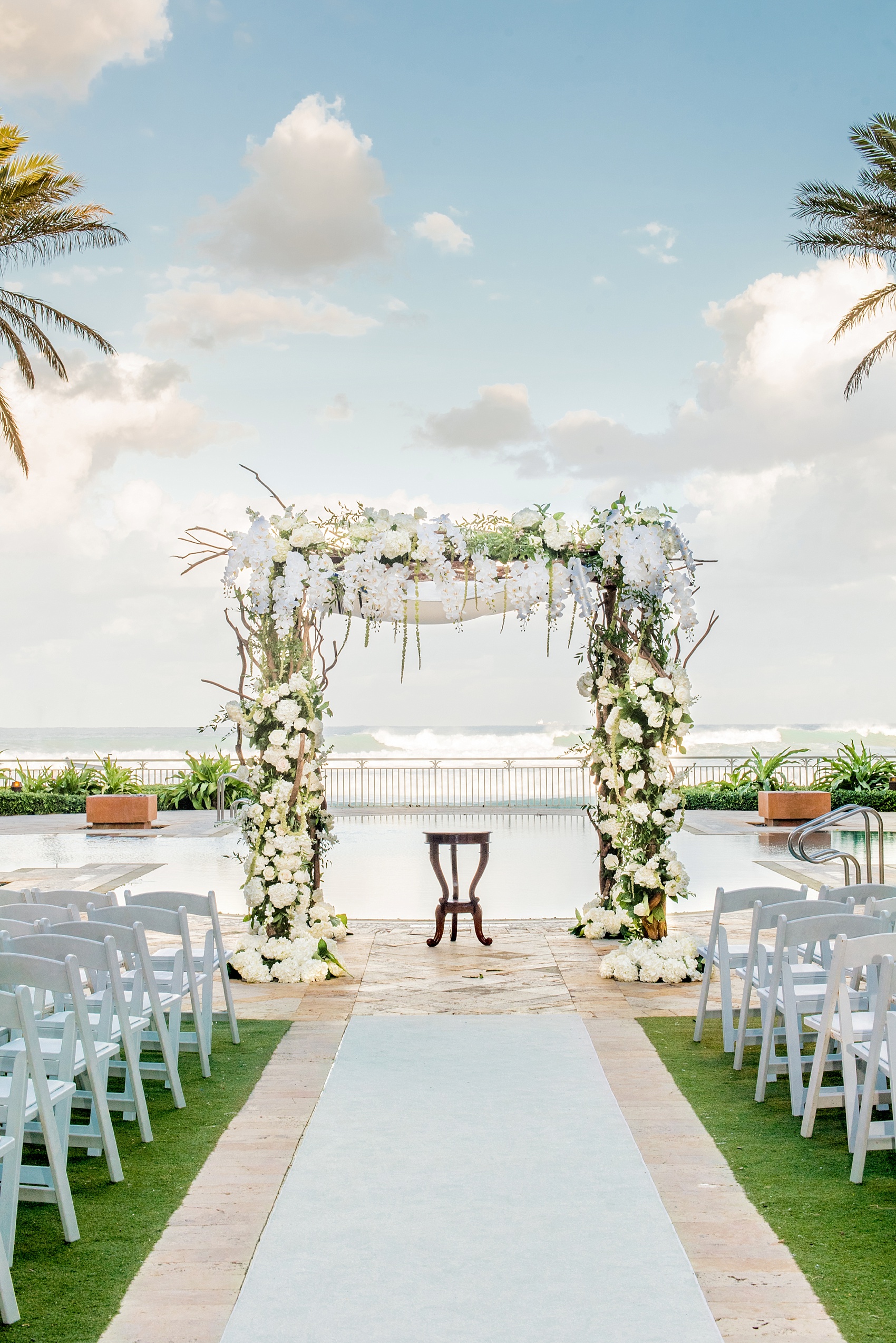Eau Palm Beach wedding photos by destination photographer, Mikkel Paige. This luxury West Palm Beach, Florida hotel is a beautiful location for a destination wedding. The traditional Jewish ceremony had a bedekan and tish, followed by an outdoor ocean front ceremony under a gorgeous chuppah. Click through to see more! #WestPalmBeach #EauPalmBeach #BeachWedding #FloridaWeddings #BeachBride #Jewishwedding #chuppah