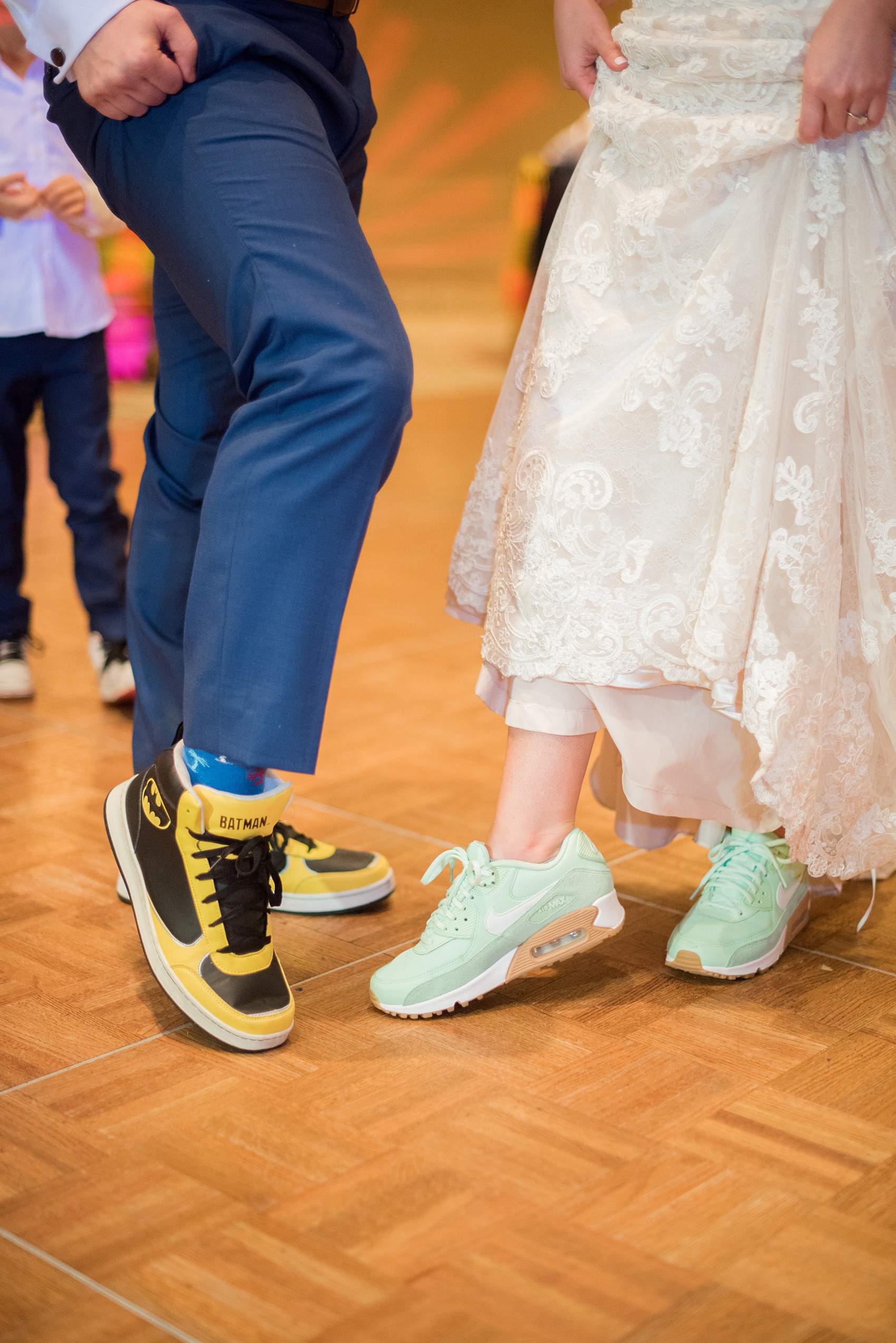 Eau Palm Beach wedding photos by destination photographer, Mikkel Paige. This luxury West Palm Beach, Florida hotel is a beautiful location for a destination wedding. The bride and groom changed into fun sneakers for their reception - the bride wore mint green Nike shoes with Hula Girl socks and the groom wore Batman high tops. Click through to see more! #WestPalmBeach #EauPalmBeach #BeachWedding #FloridaWeddings #BeachBride #HulaGirl #Batman