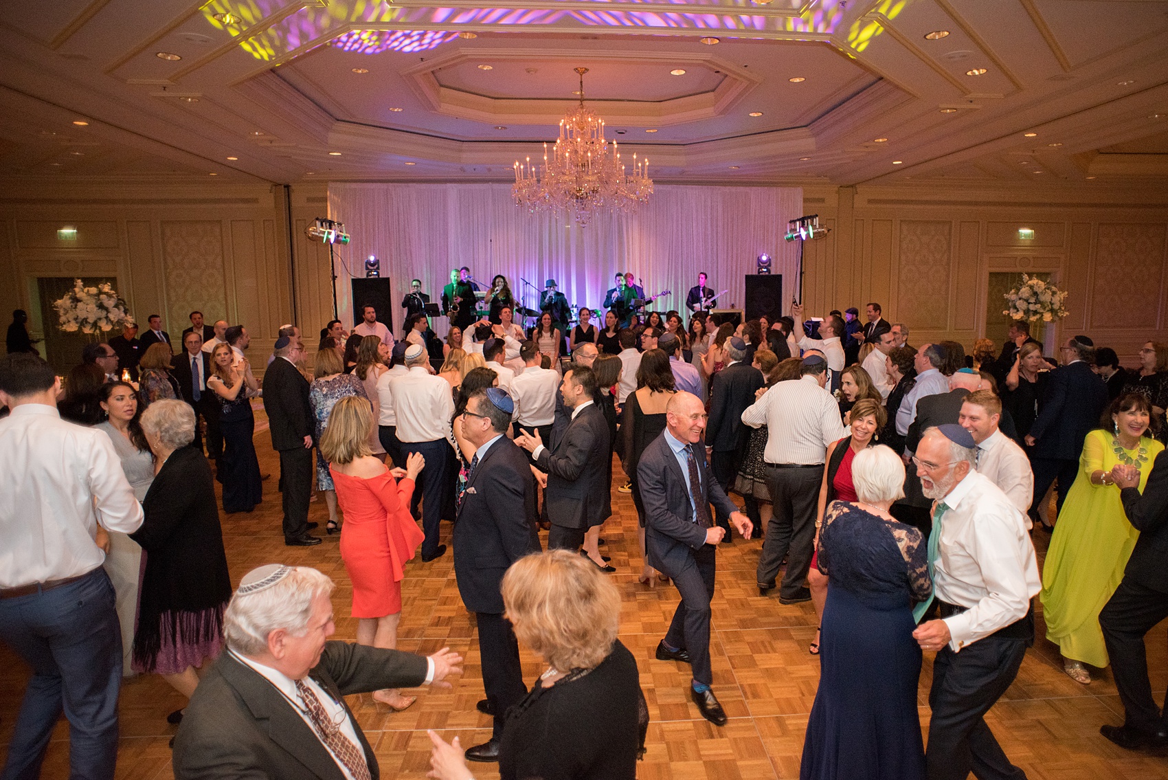 Eau Palm Beach wedding photos by destination photographer, Mikkel Paige. This luxury West Palm Beach, Florida hotel is a beautiful location for a destination wedding. The bride and groom danced the night away with their guests in a ballroom reception, with the music of a live band. Click through to see more! #WestPalmBeach #EauPalmBeach #BeachWedding #FloridaWeddings #BeachBride #CakeCutting #ShellCake