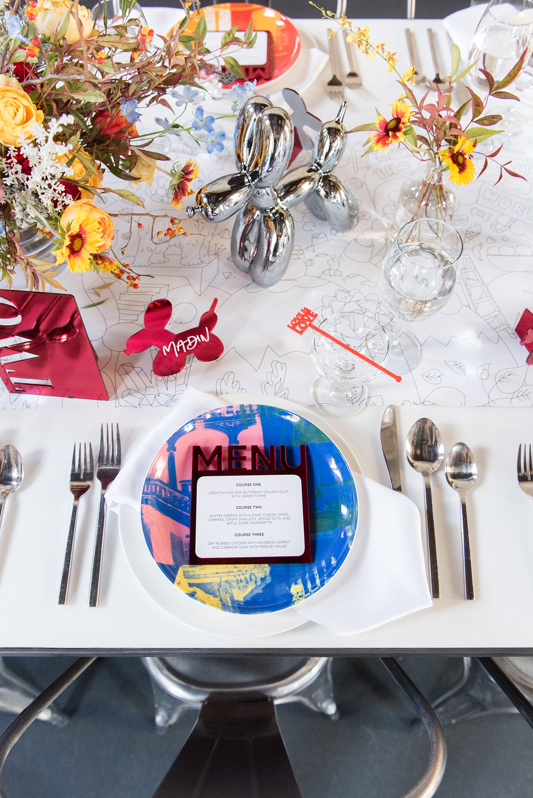 Mikkel Paige Photography images of a wedding at the Green Building in Brooklyn, New York. This same sex, gay marriage styled shoot was created by Color Pop Events. The dinner table was styled by Taylor and Hov, inspired by Jeff Koons and neo pop art.