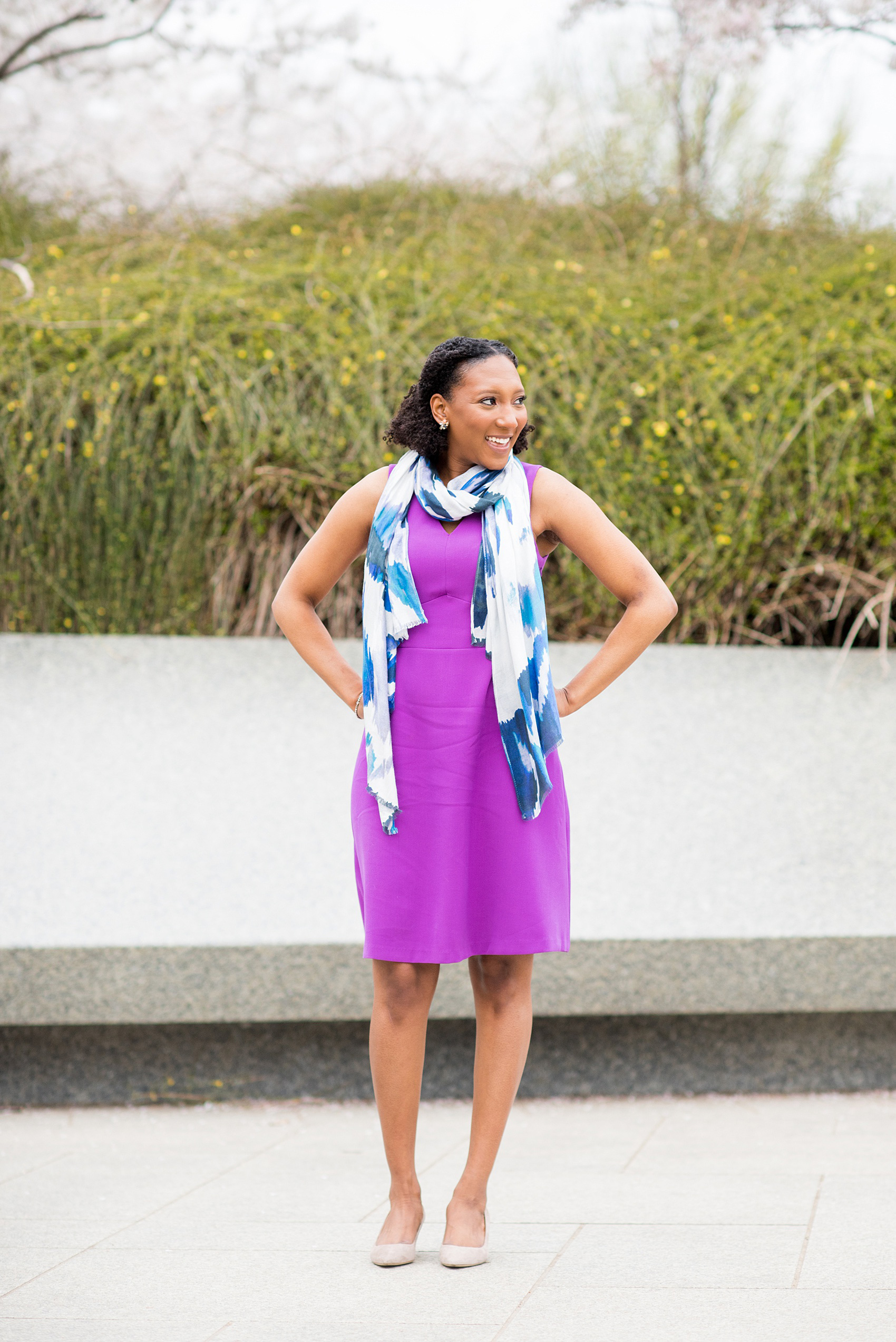 DC Cherry Blossoms Engagement Photos by Mikkel Paige Photography. Spring flowers around the MLK memorial and Tidal Basin at the nation's Capitol with an African American bride in a colorful outfit. #DCCherryBlossoms #CherryBlossoms #EngagementPhotos #SpringEngagementPhotos #CherryBlossomsEngagementPhotos