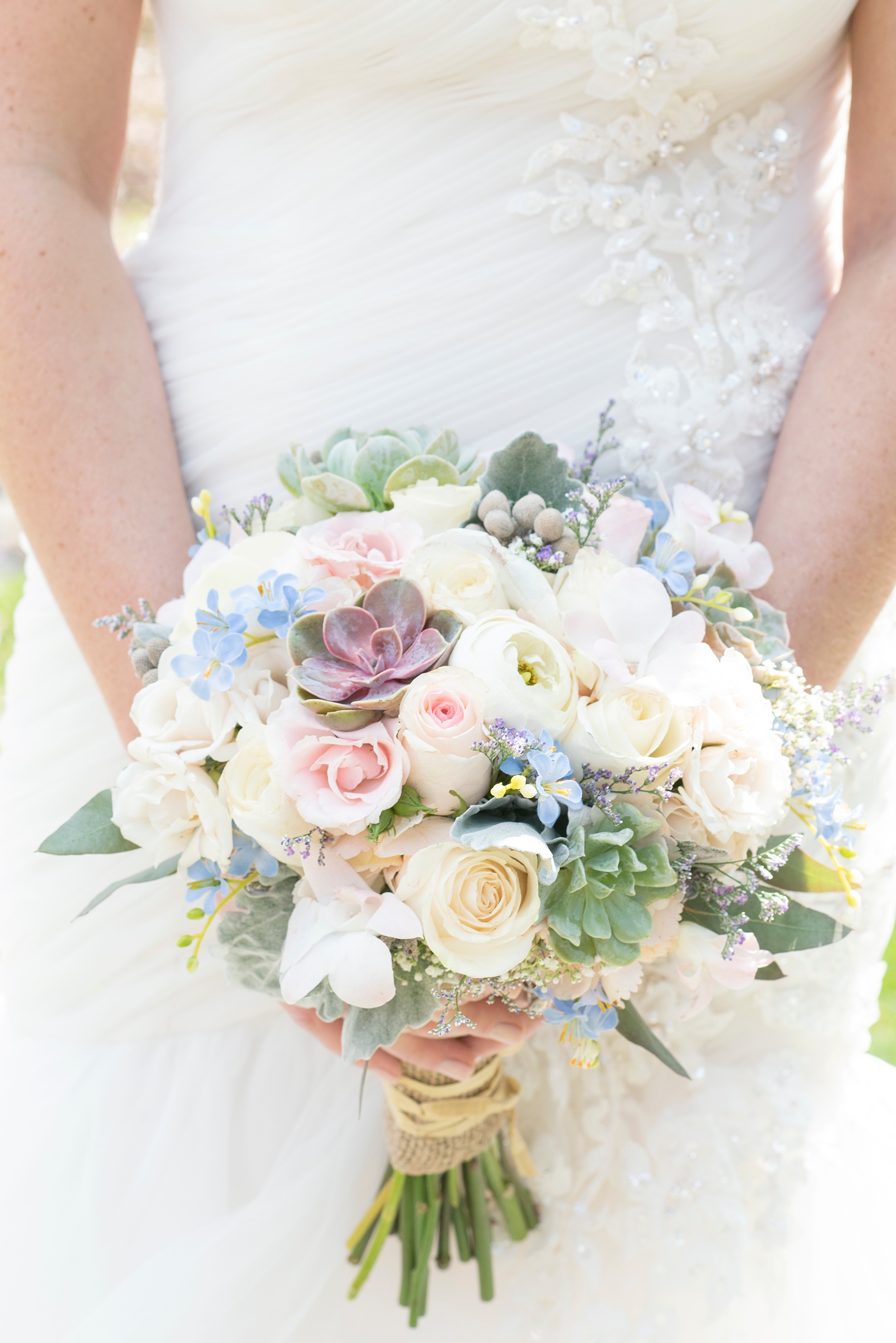Crystal Springs Resort wedding photos by Mikkel Paige Photography in New Jersey.  The bride carried a bouquet of spring blossoms.