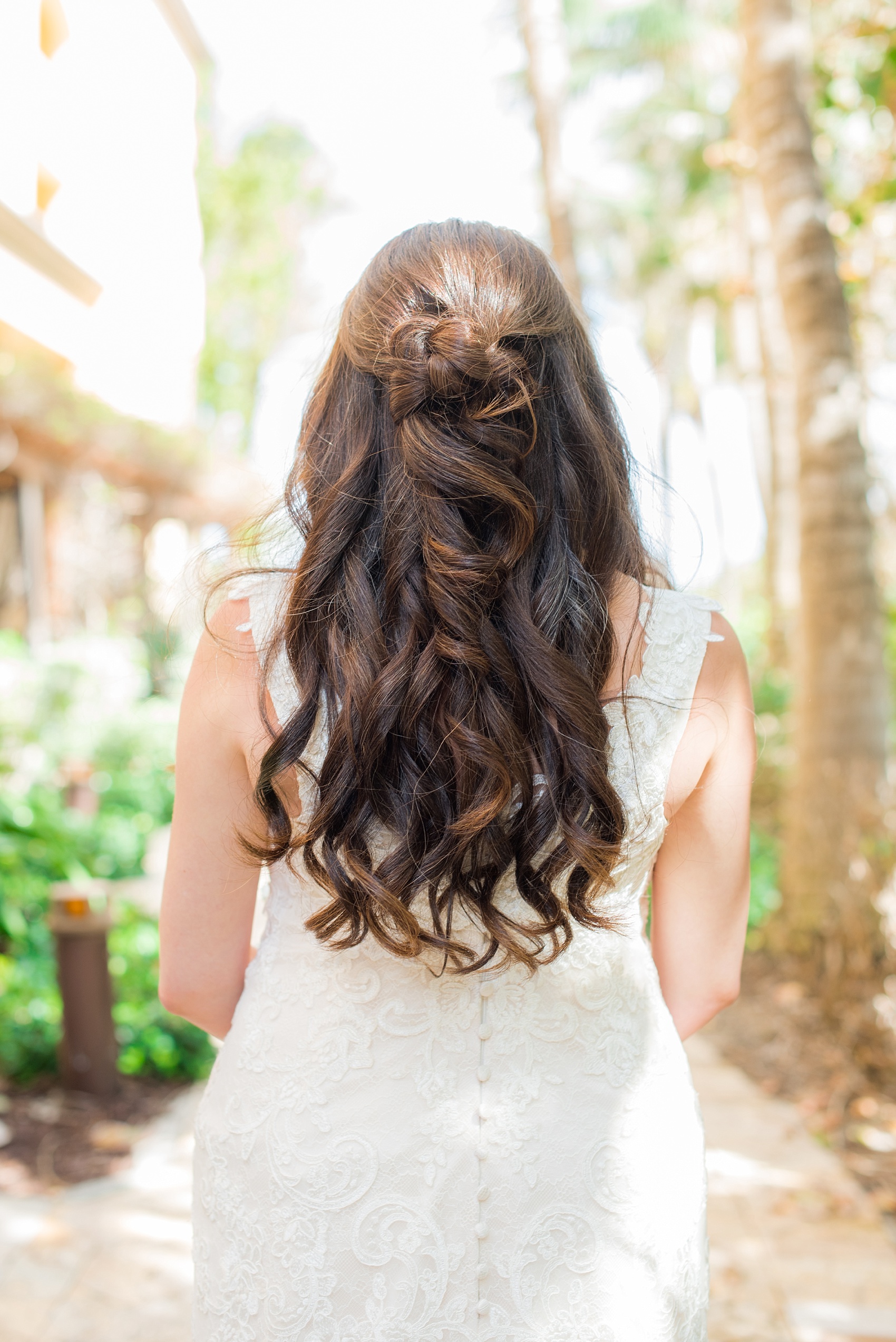 Eau Palm Beach wedding photos by destination photographer, Mikkel Paige. This luxury Florida hotel is a beautiful location for a destination wedding. The bride wore her hair half up with a "knot" detail in the back. Click through to see more! #WestPalmBeach #EauPalmBeach #BeachWedding #FloridaWeddings #BeachBride