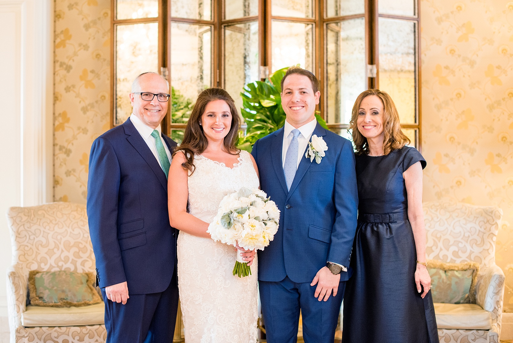 Eau Palm Beach wedding photos by Mikkel Paige Photography. This luxury Florida resort is a beautiful destination location for a wedding! The ornate lobby was the perfect location for family photos. Click through for more details from this waterfront wedding! #WestPalmBeach #EauPalmBeach #BeachWedding #turtles