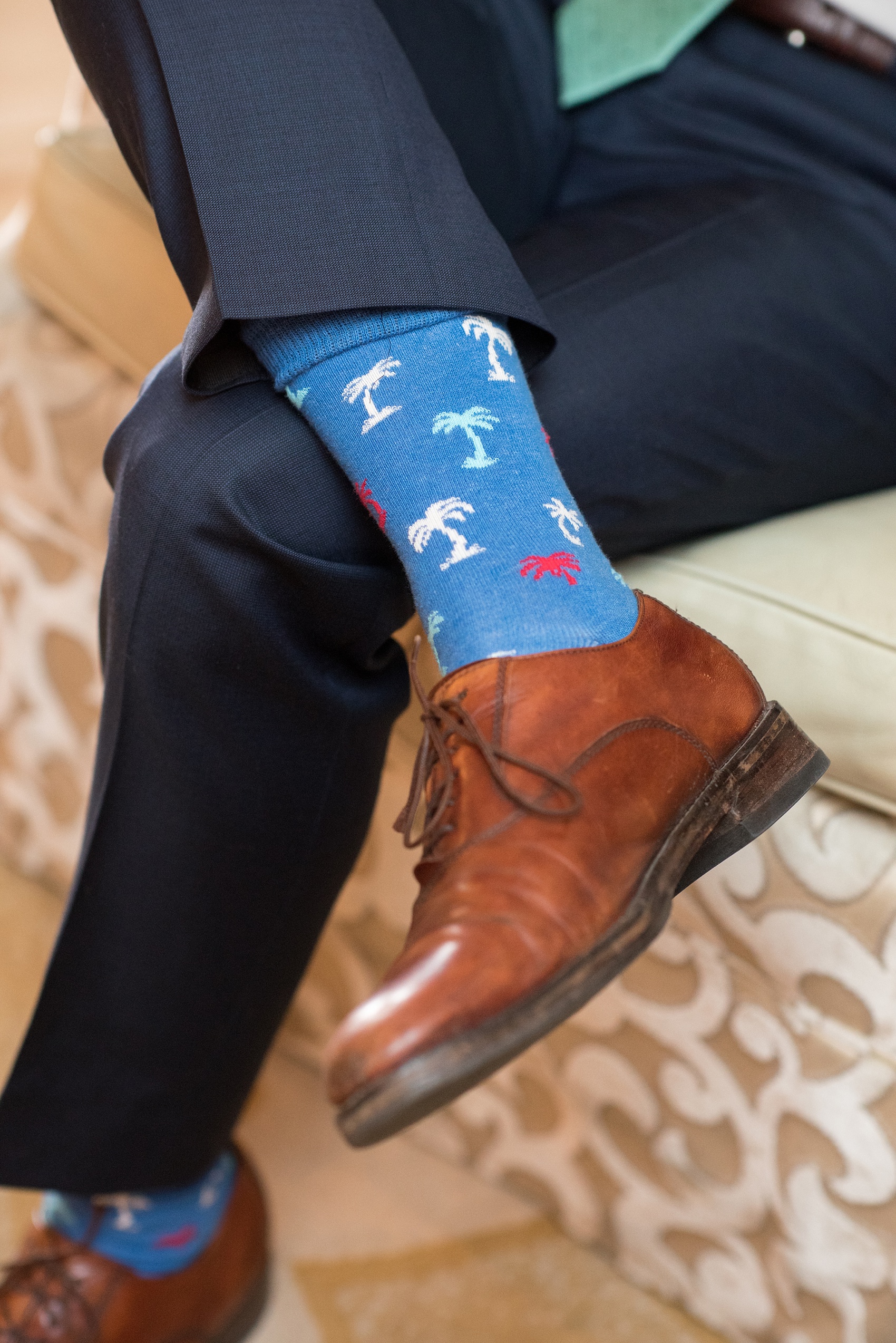 Eau Palm Beach wedding photos by destination photographer, Mikkel Paige. This luxury West Palm Beach, Florida hotel is a beautiful location for a destination wedding. The groomsmen wore navy blue suits with blue socks that had primary color palm trees on them. This is one of many wonderful details from the wedding! Click through to see more! #WestPalmBeach #EauPalmBeach #BeachWedding #FloridaWeddings #BeachBride