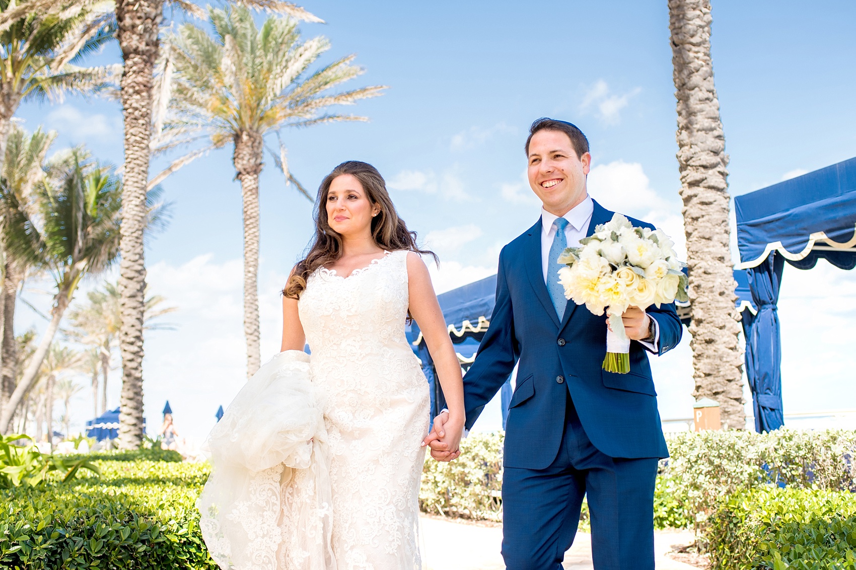 Eau Palm Beach wedding photos by Mikkel Paige Photography. This luxury Florida resort is a beautiful location for a destination wedding. The bride and groom took pictures around the beach front hotel. Click through to see more! #WestPalmBeach #EauPalmBeach #BeachWedding #FloridaWeddings #BeachBride #BeachWedding