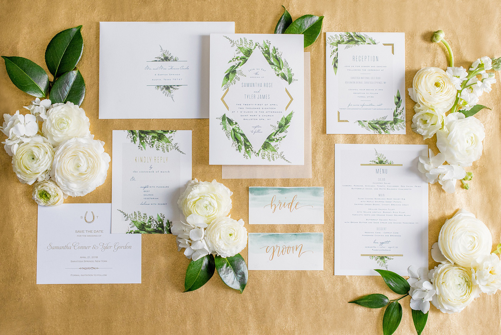 Photo of a green invitation in a flower lay flat picture by Mikkel Paige Photography for a wedding in Saratoga Springs, New York. The spring destination wedding photos are from a reception held at the Saratoga National Golf Club venue. #SaratogaSpringsNY #SaratogaSprings #mikkelpaige #NYwedding #destinationwedding