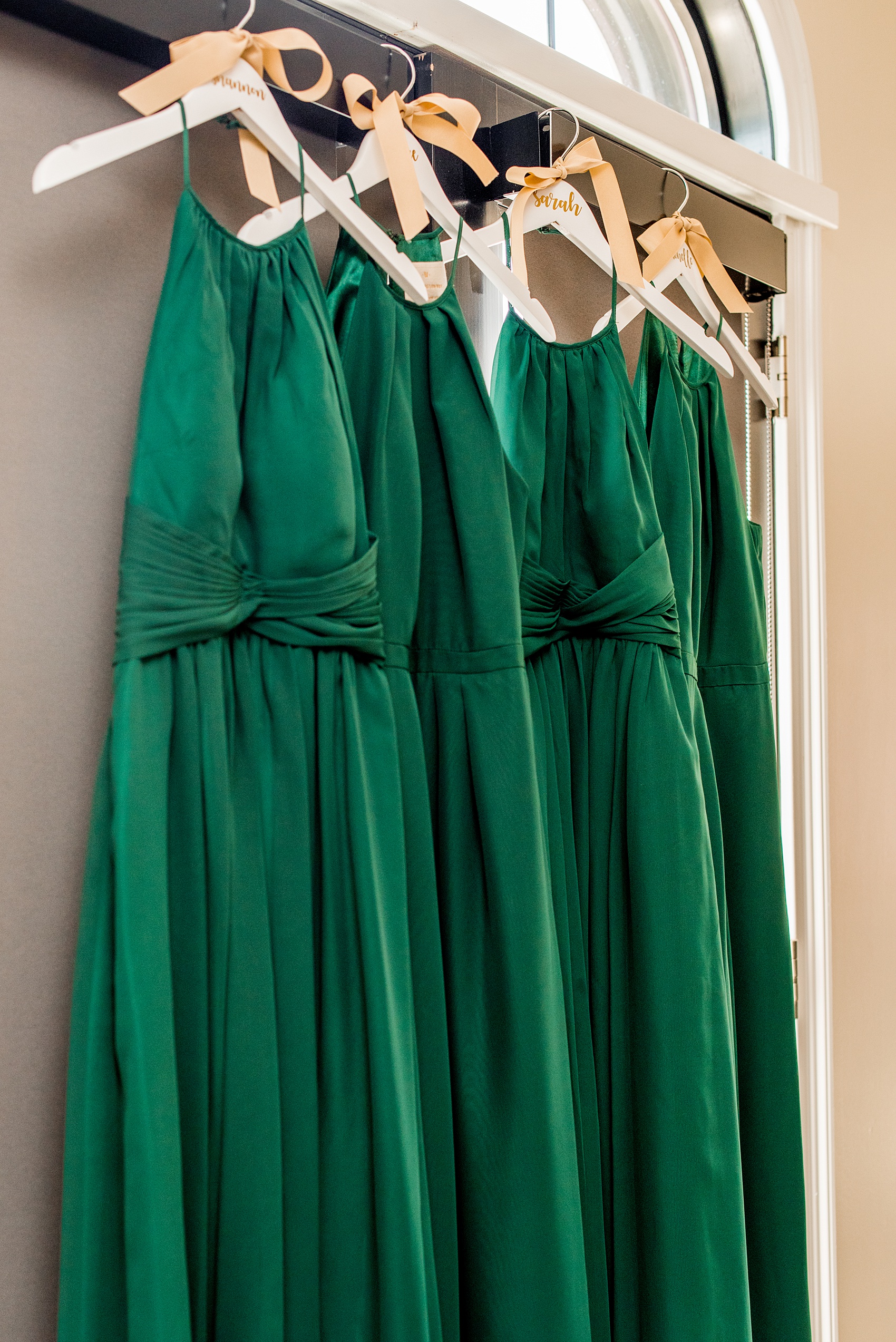 Saratoga Springs destination wedding photos by Mikkel Paige Photography. The bridal party got ready at the Pavilion Grand hotel and wore dark green gowns for the April spring wedding with a green and gold color palette. #SaratogaSpringsNY #SaratogaSprings #mikkelpaige #NYwedding #destinationwedding #bridesmaidsgown #greenandgoldweddingcolors #greenandgoldweddingpalette