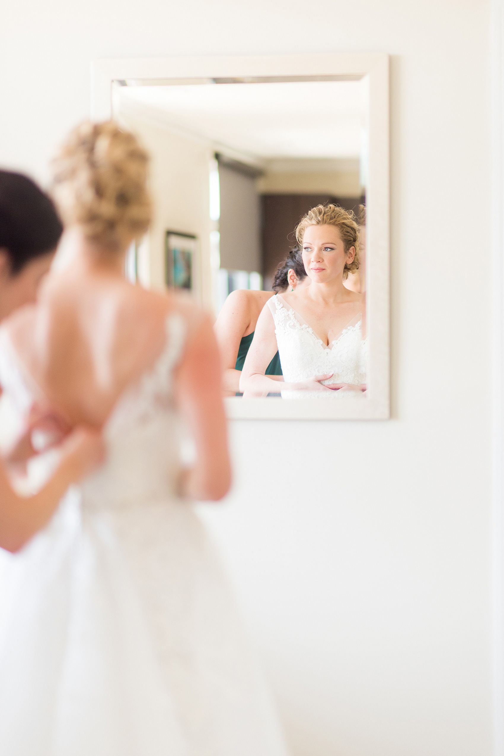 Saratoga Springs destination wedding photos by Mikkel Paige Photography. The bride got ready at the Pavilion Grand hotel and wore a lace gown that her sister and Maid of Honor helped her get ready in. The spring reception was held at Saratoga National Golf Club venue. #SaratogaSpringsNY #SaratogaSprings #mikkelpaige #NYwedding #destinationwedding 