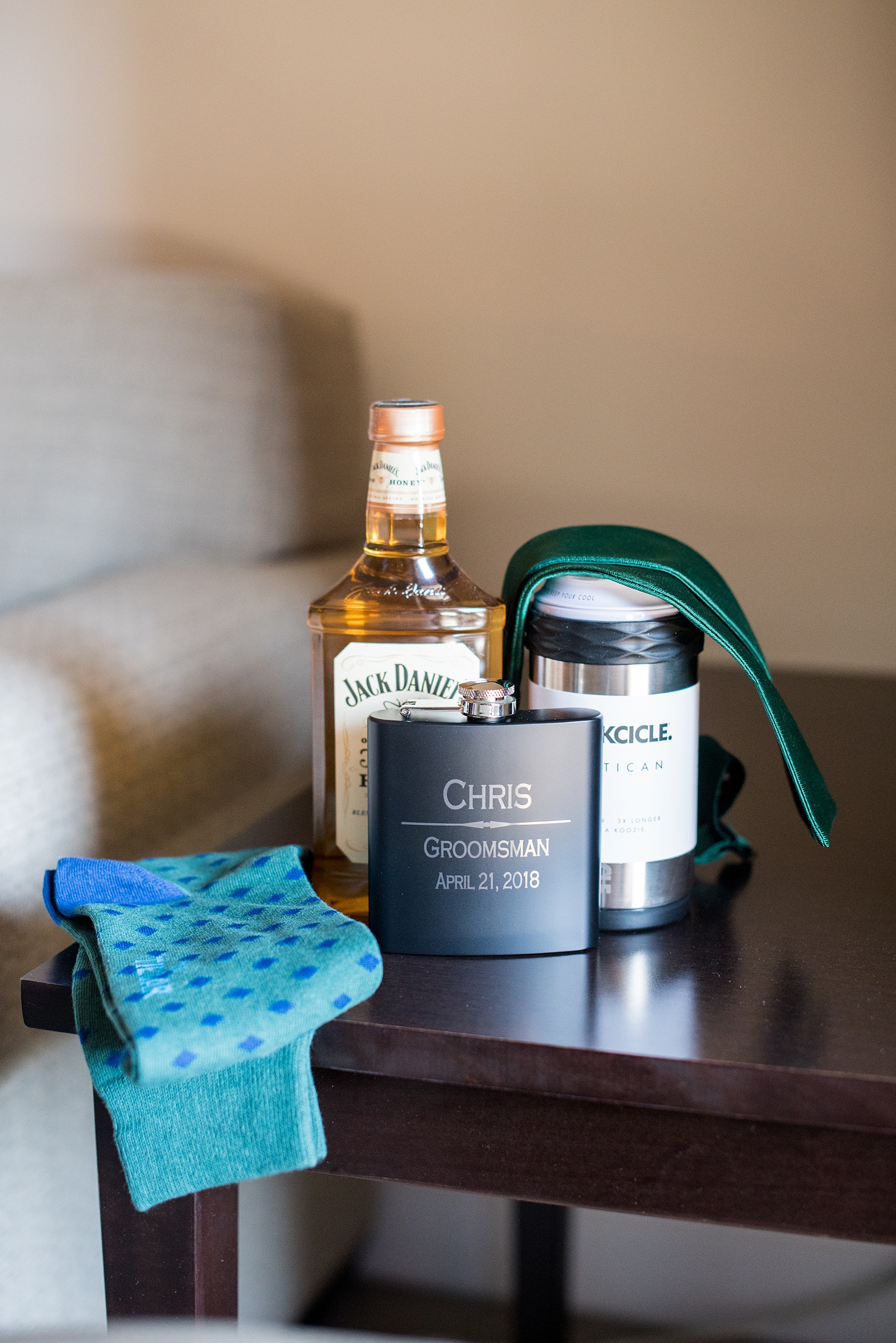 Saratoga Springs destination wedding photos by Mikkel Paige Photography. The groomsmen got ready at the Pavilion Grand hotel downtown. The groom got his groomsmen custom flasks, Corksicle can holders, green bow ties and Tie Bar socks, and whiskey for his April spring wedding. #SaratogaSpringsNY #SaratogaSprings #mikkelpaige #NYwedding #destinationwedding 