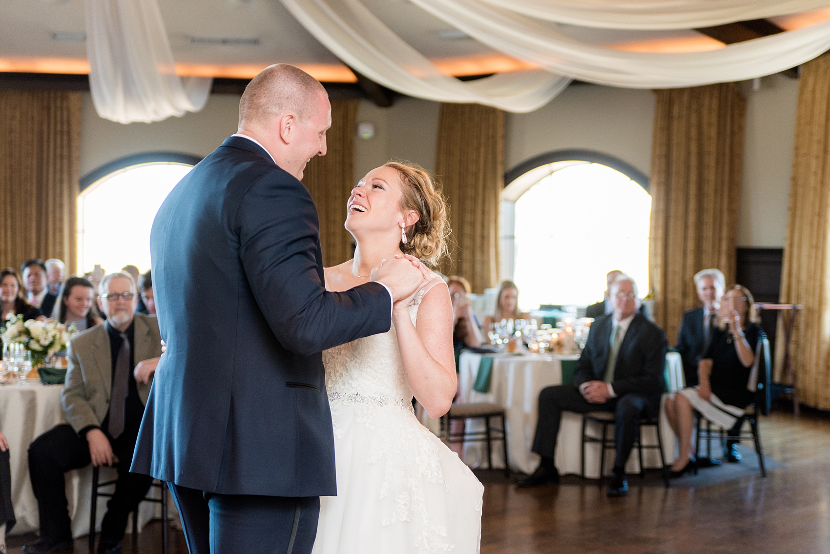 Saratoga Springs destination wedding photos by Mikkel Paige Photography. The spring event was held at Saratoga National Golf Club venue. The bride and groom shared a first dance moment. #SaratogaSpringsNY #SaratogaSprings #mikkelpaige #NYwedding #destinationwedding #saratogaweddingvenue #golfcoursewedding #firstdance #springwedding