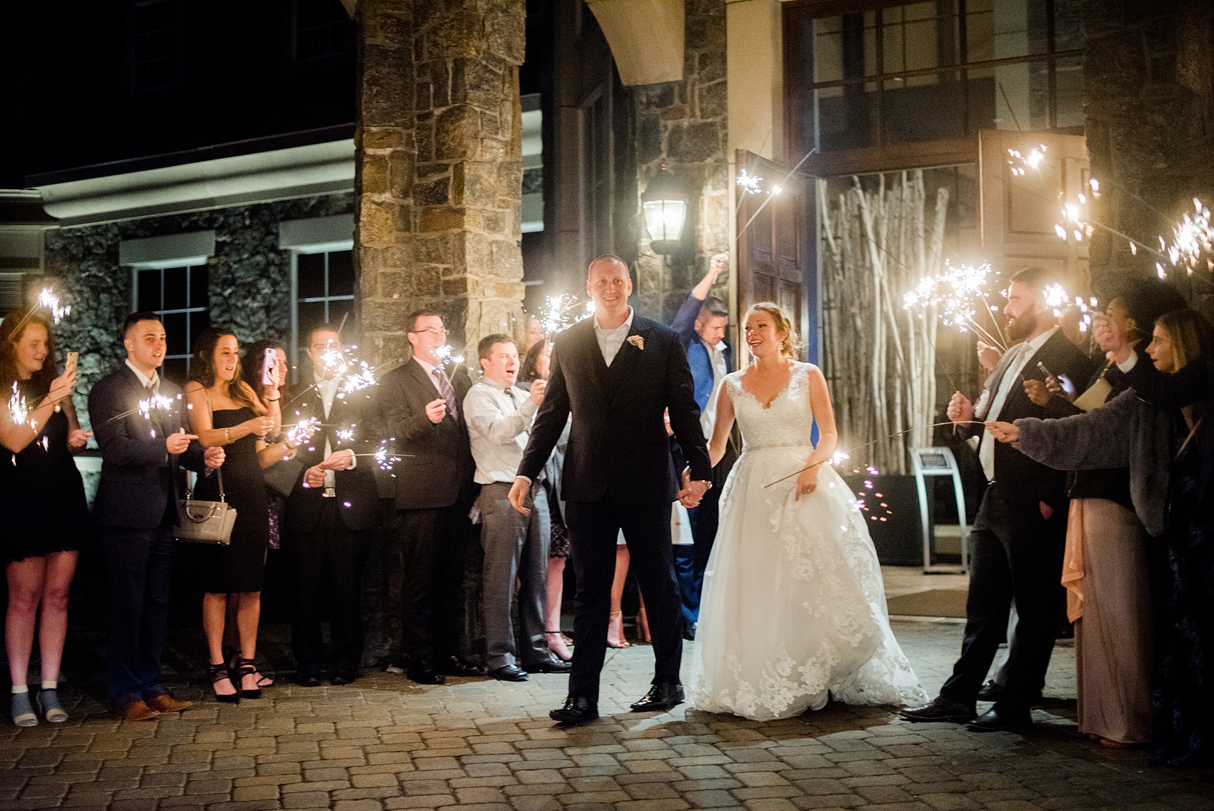 Saratoga Springs destination wedding photos by Mikkel Paige Photography. The party was held at Saratoga National Golf Club venue. The bride and groom did a sparkler exit from their spring reception. #SaratogaSpringsNY #SaratogaSprings #mikkelpaige #NYwedding #destinationwedding #sparklerexit