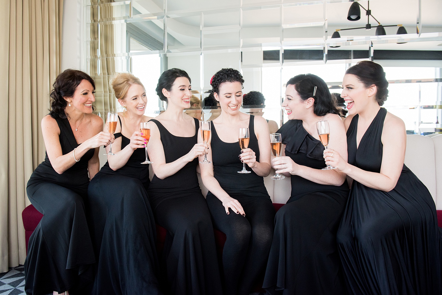 W Hoboken wedding photos by Mikkel Paige Photography at this NJ venue. Pictures in this well known New Jersey city with a view of the NYC skyline. Image of the bridesmaids toasting with rose champagne during getting ready. #mikkelpaige #HobokenWedding #NewJerseyPhotographer #NewYorkCityPhotographer #NYCweddingphotographer #brideandgroomphotos #redpeonies #romanticwedding #springwedding #CityWedding